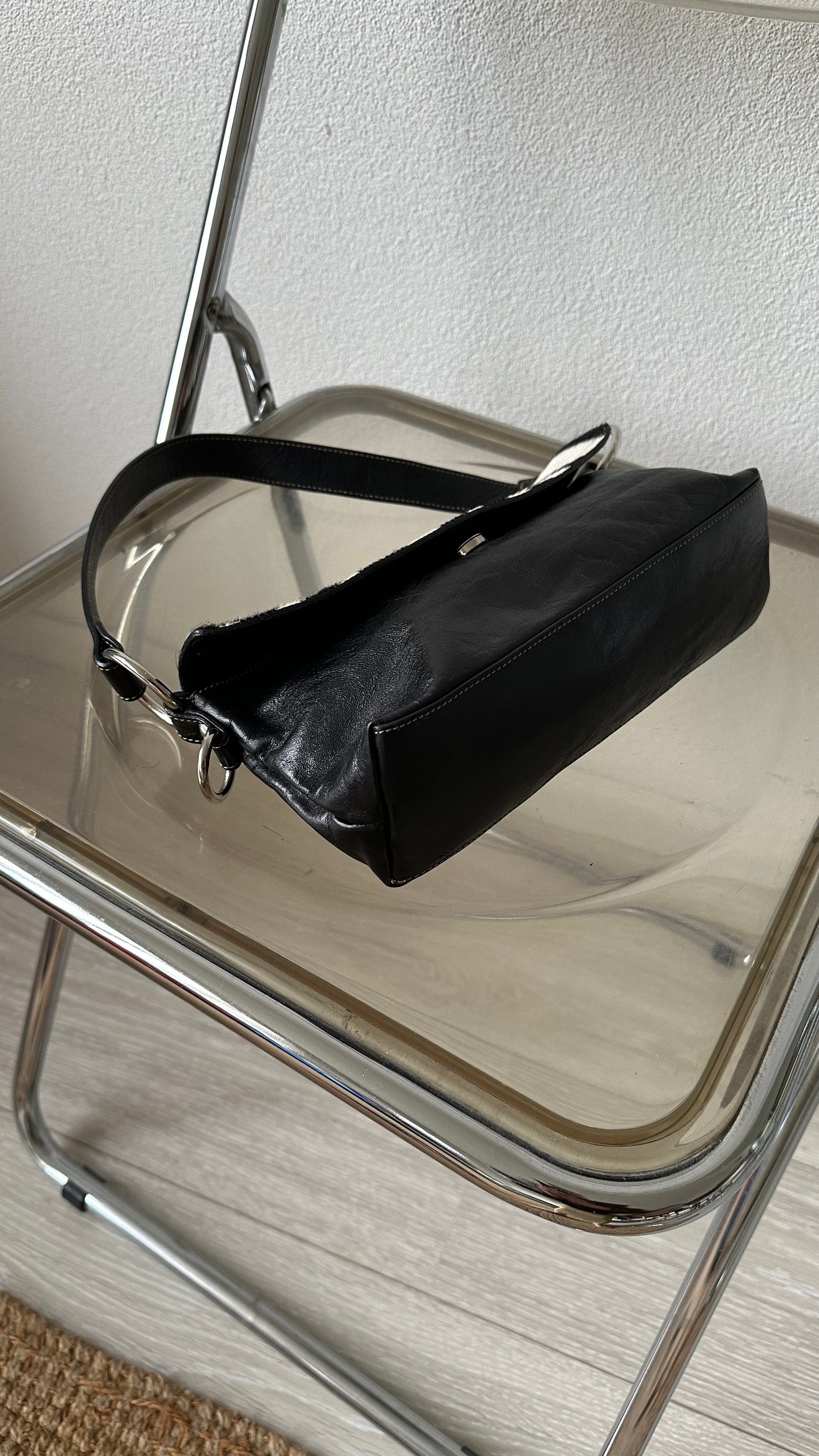 black leather handbag with zebra flap
