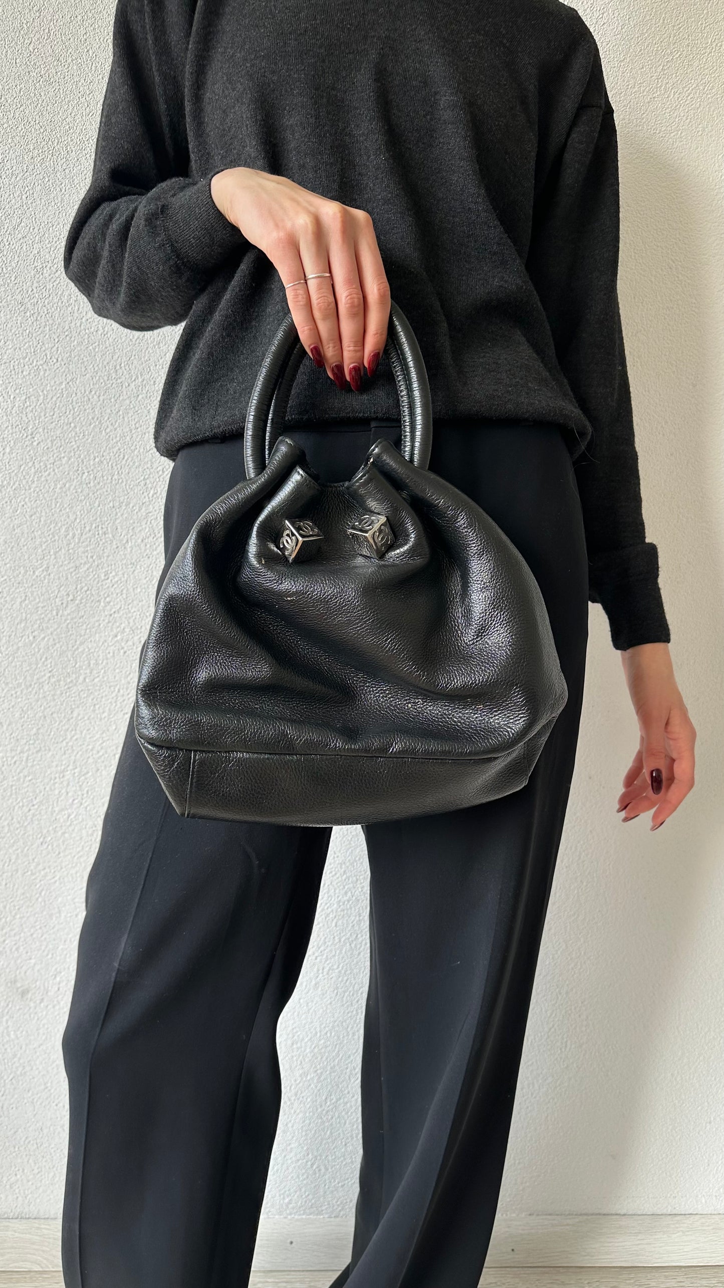 black leather bucket bag with red lining
