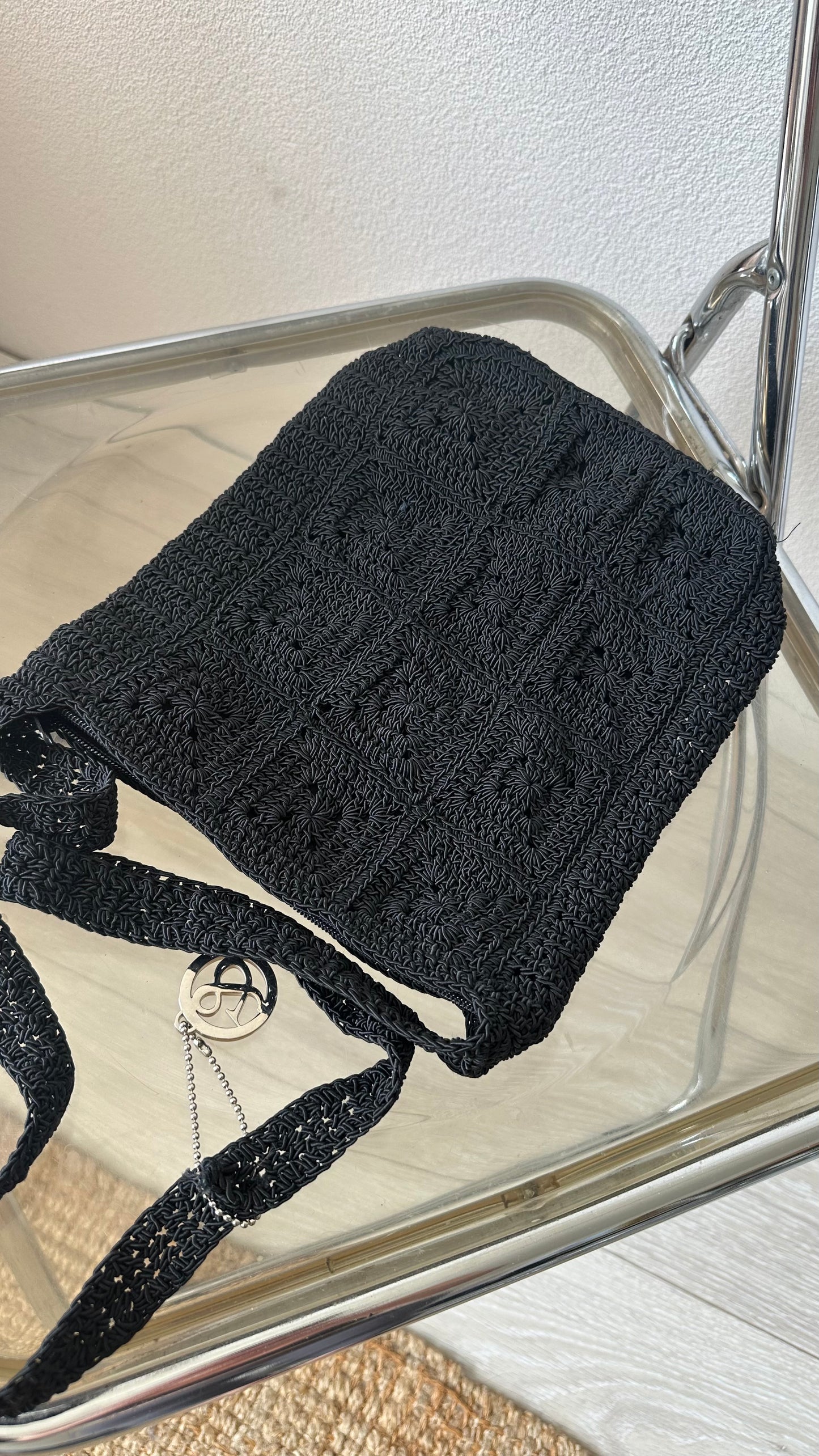black textured crossbody bag