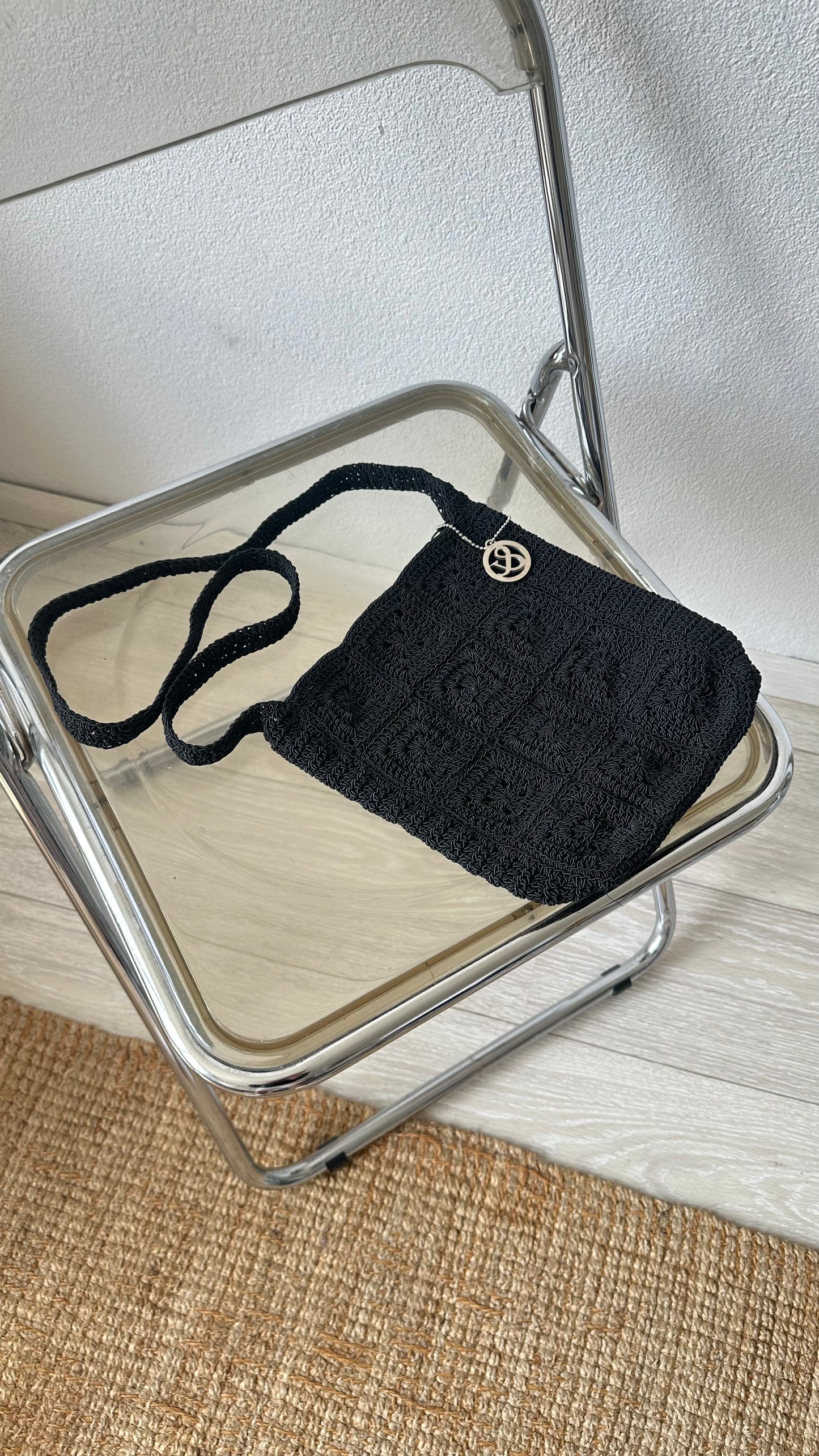 black textured crossbody bag