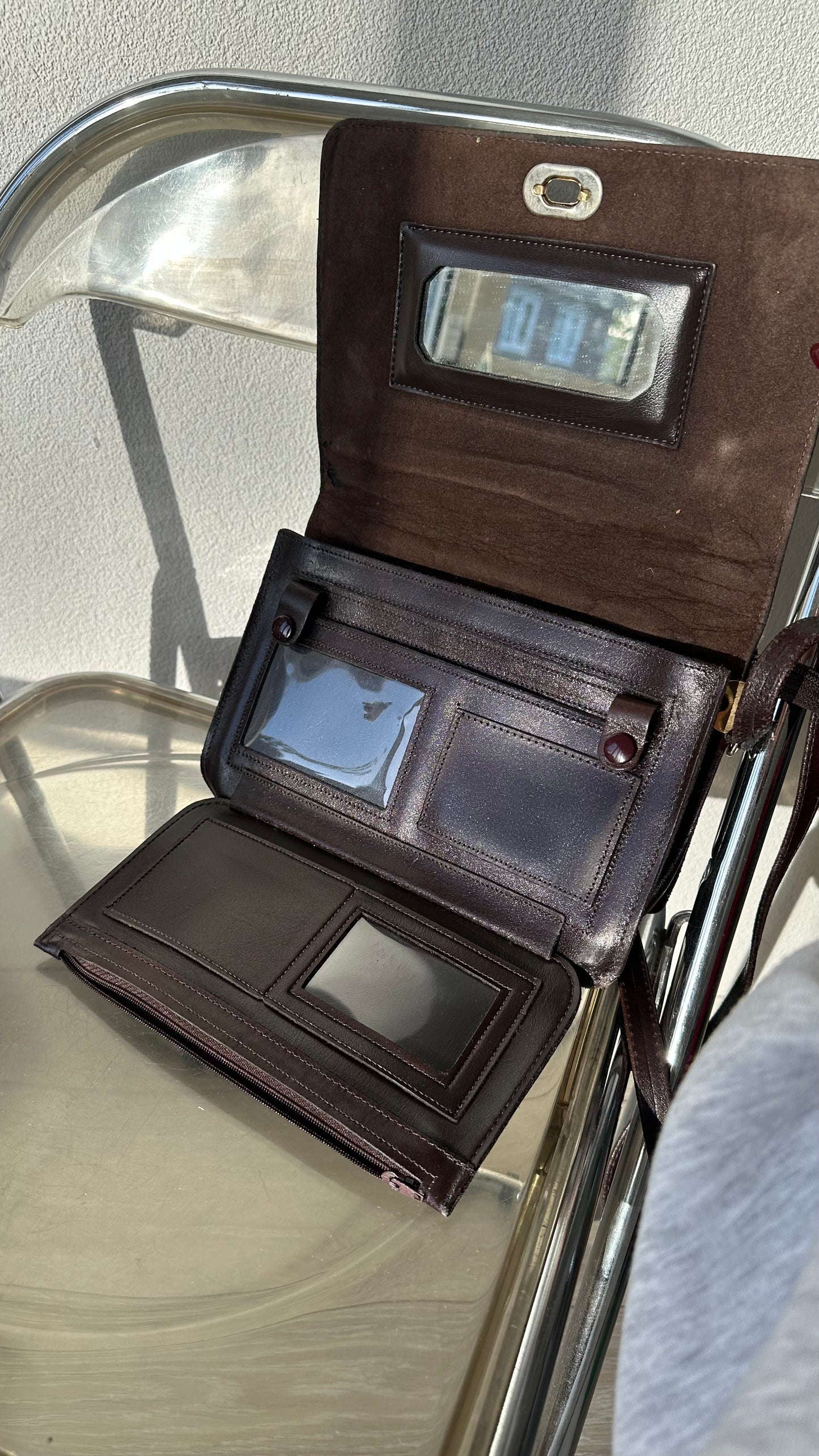 vintage brown leather messenger bag with organiser details and gold twist lock