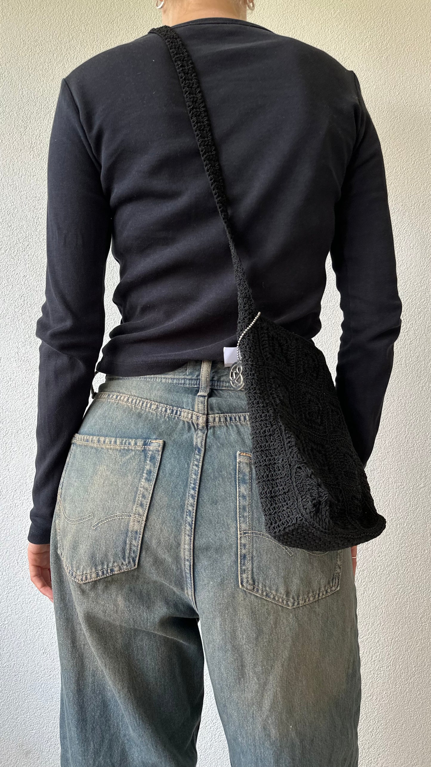 black textured crossbody bag