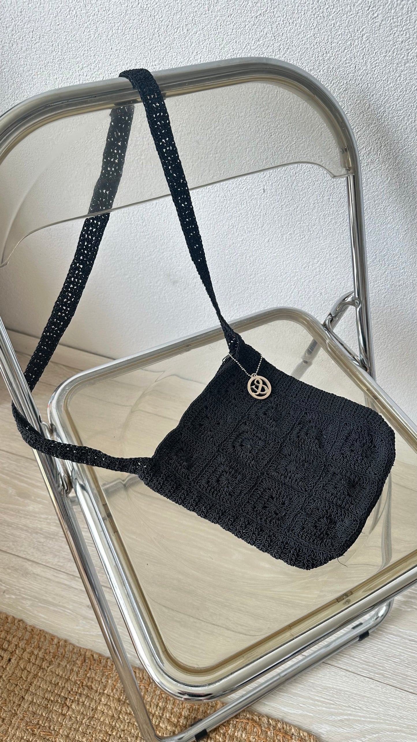 black textured crossbody bag