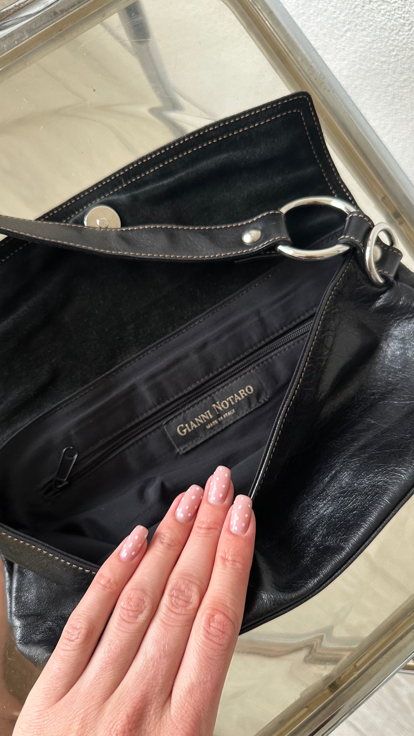 black leather handbag with zebra flap