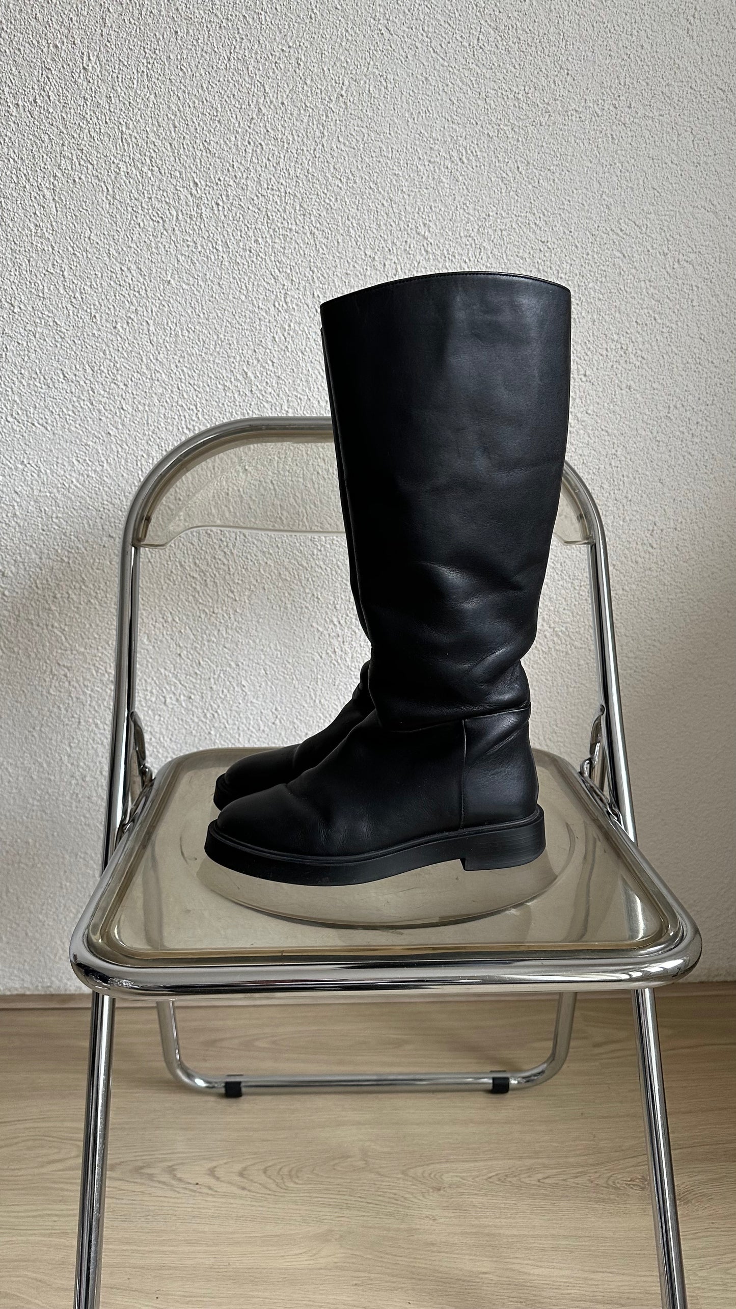 black leather high riding boots