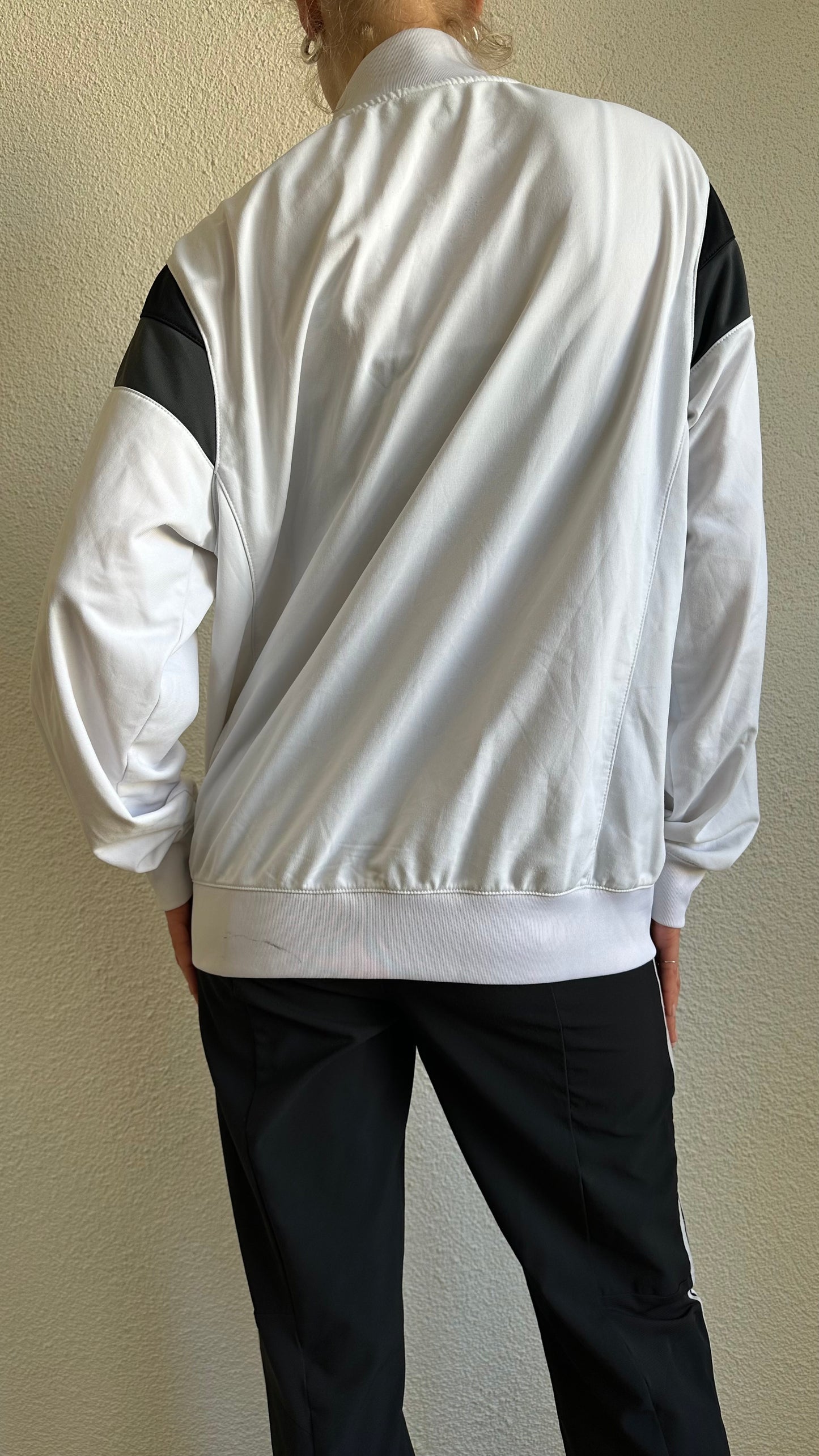 black, white and grey vest nike
