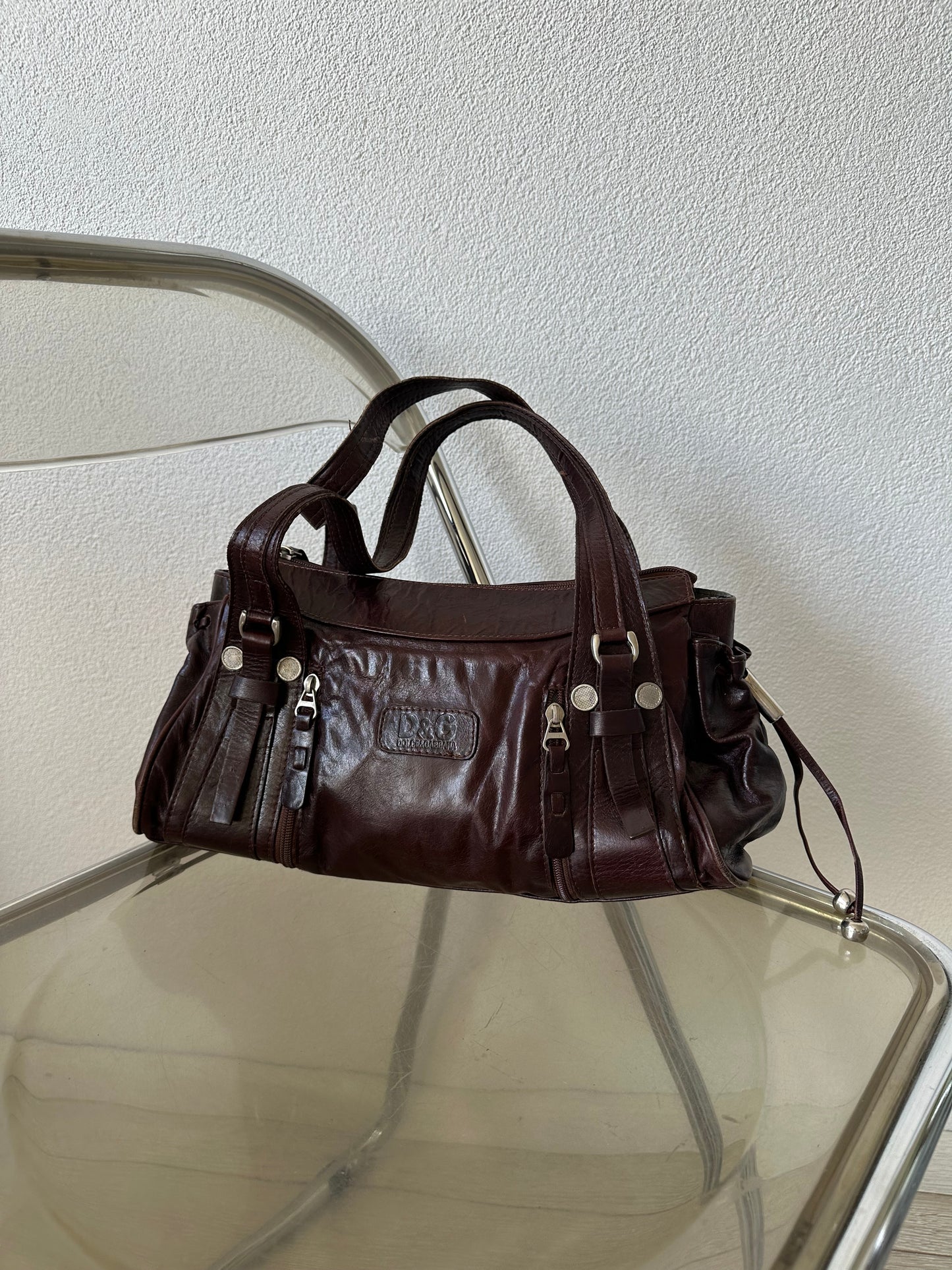 brown leather shoulder bag with silver hardware