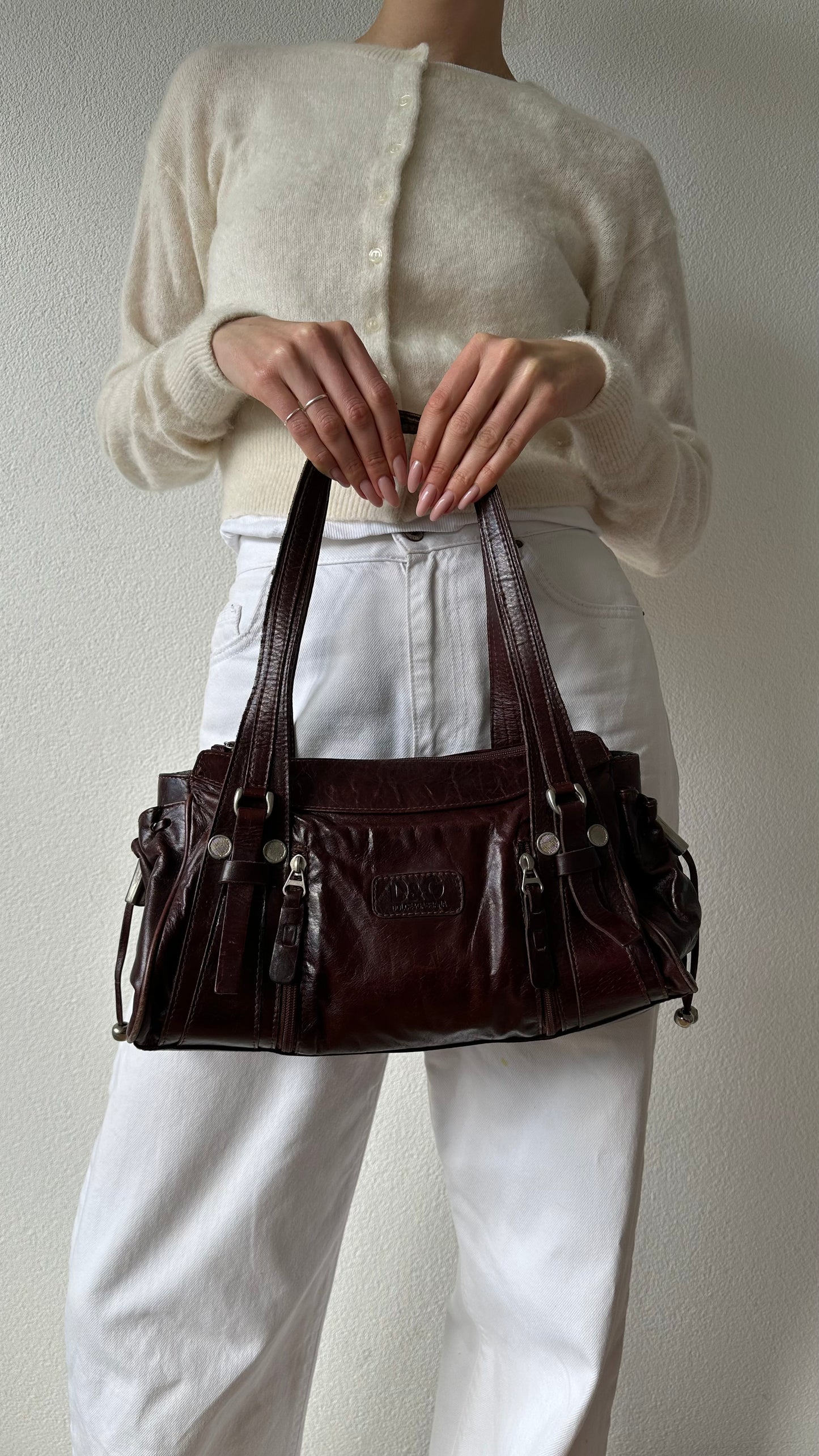 brown leather shoulder bag with silver hardware