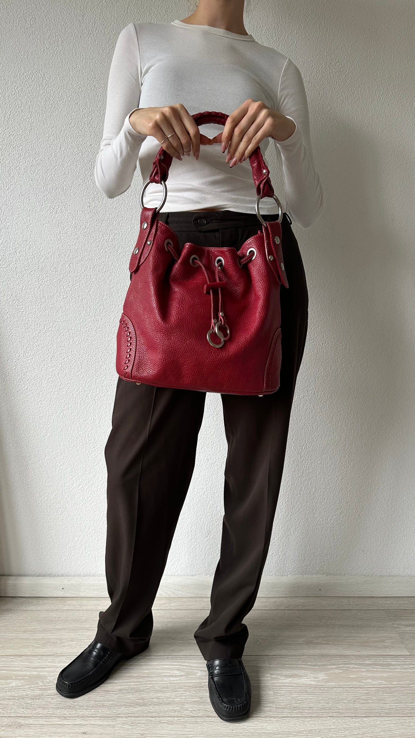 tods red leather bucket bag with silver hardware