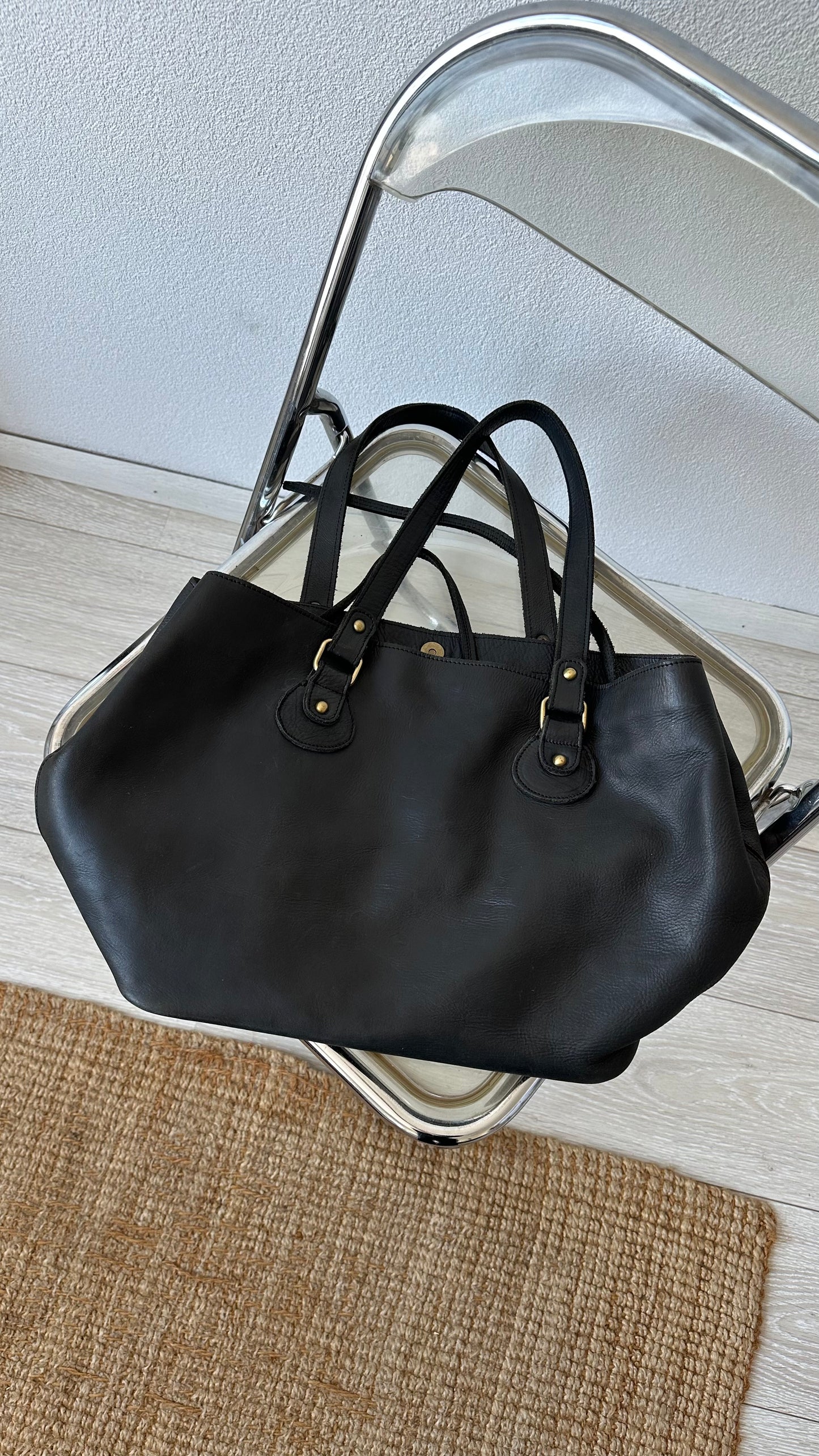 black leather shoulderbag with golden details