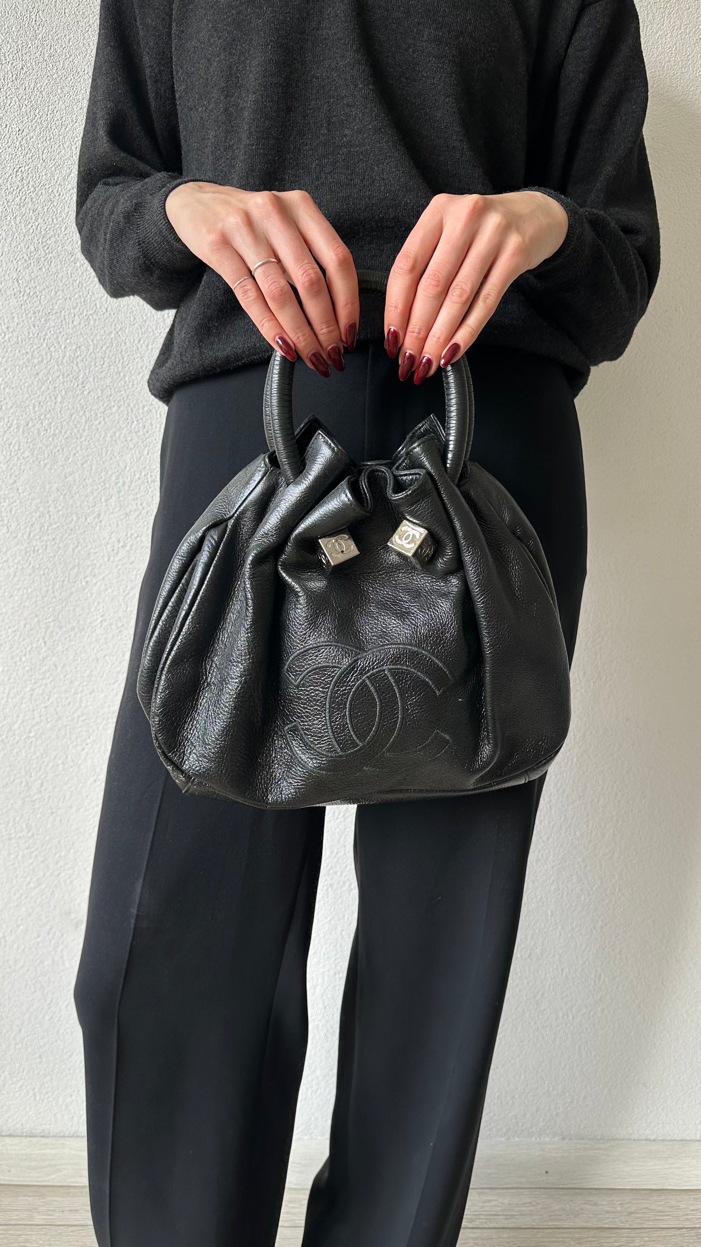 black leather bucket bag with red lining