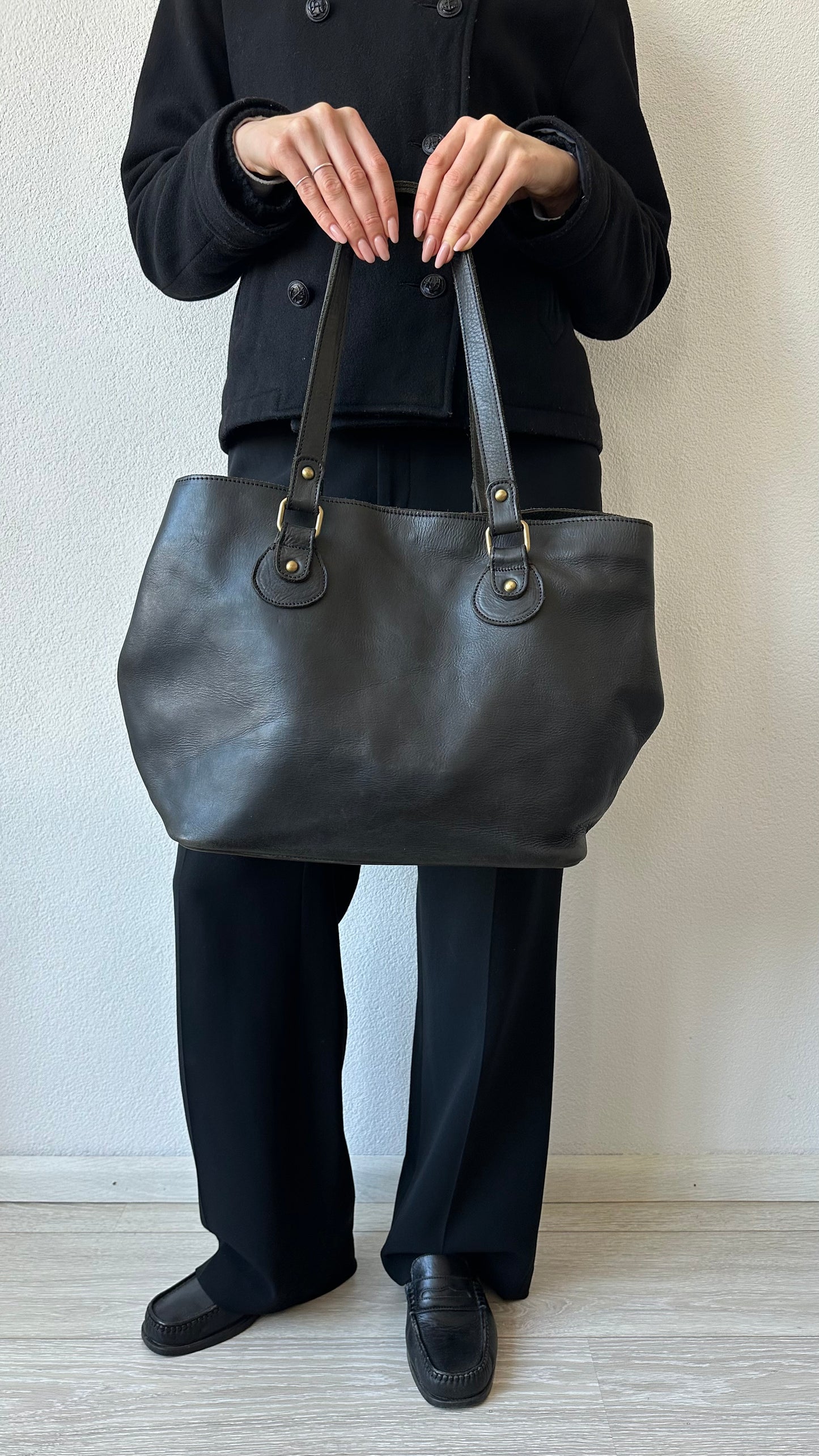black leather shoulderbag with golden details