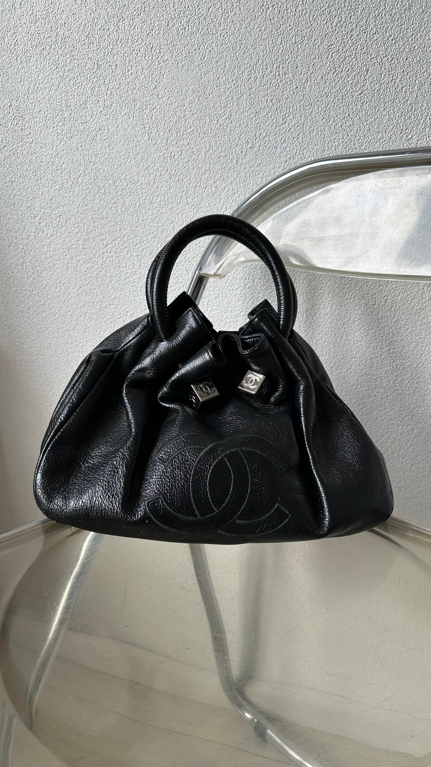 black leather bucket bag with red lining