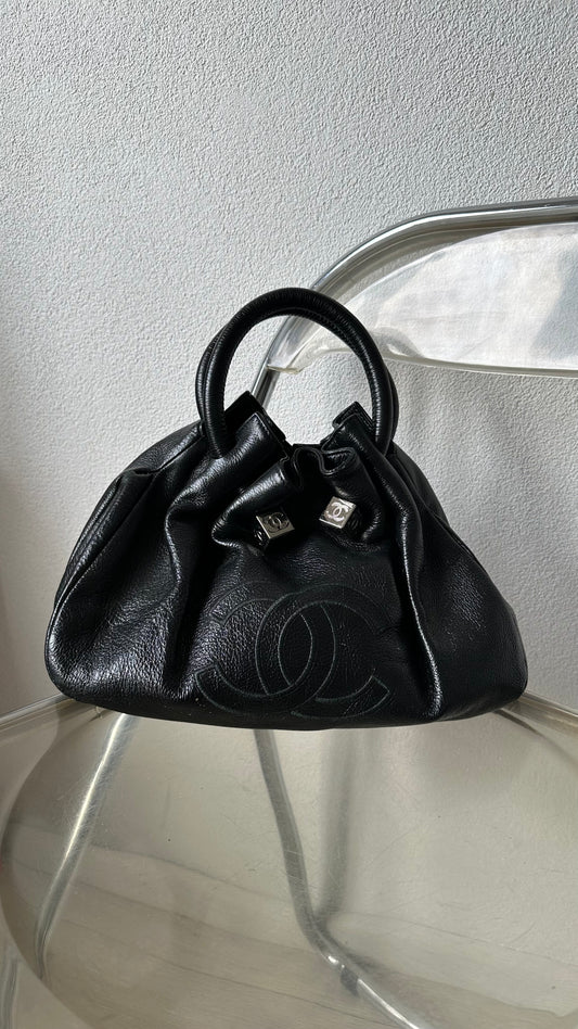 black leather bucket bag with red lining