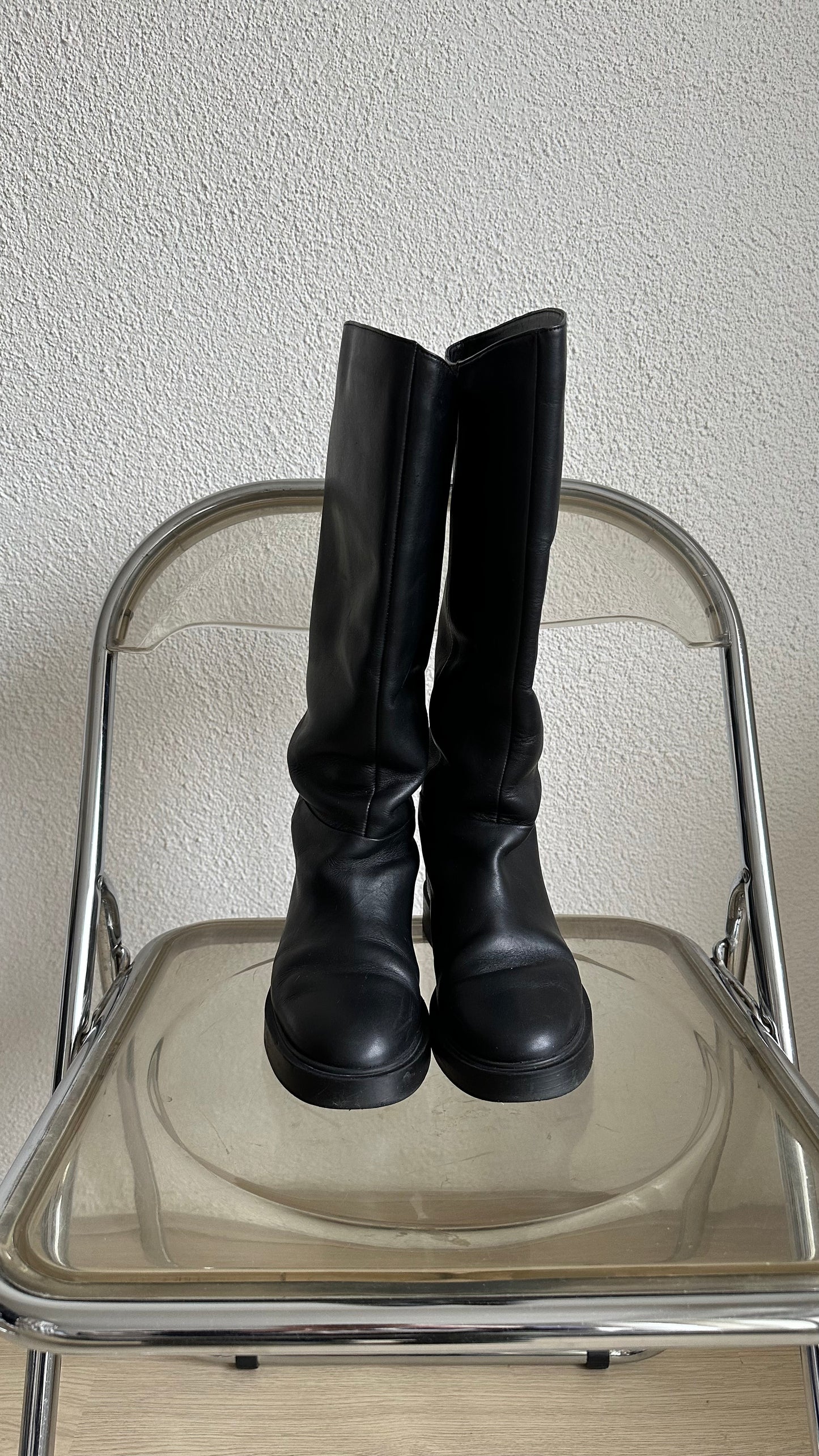 black leather high riding boots