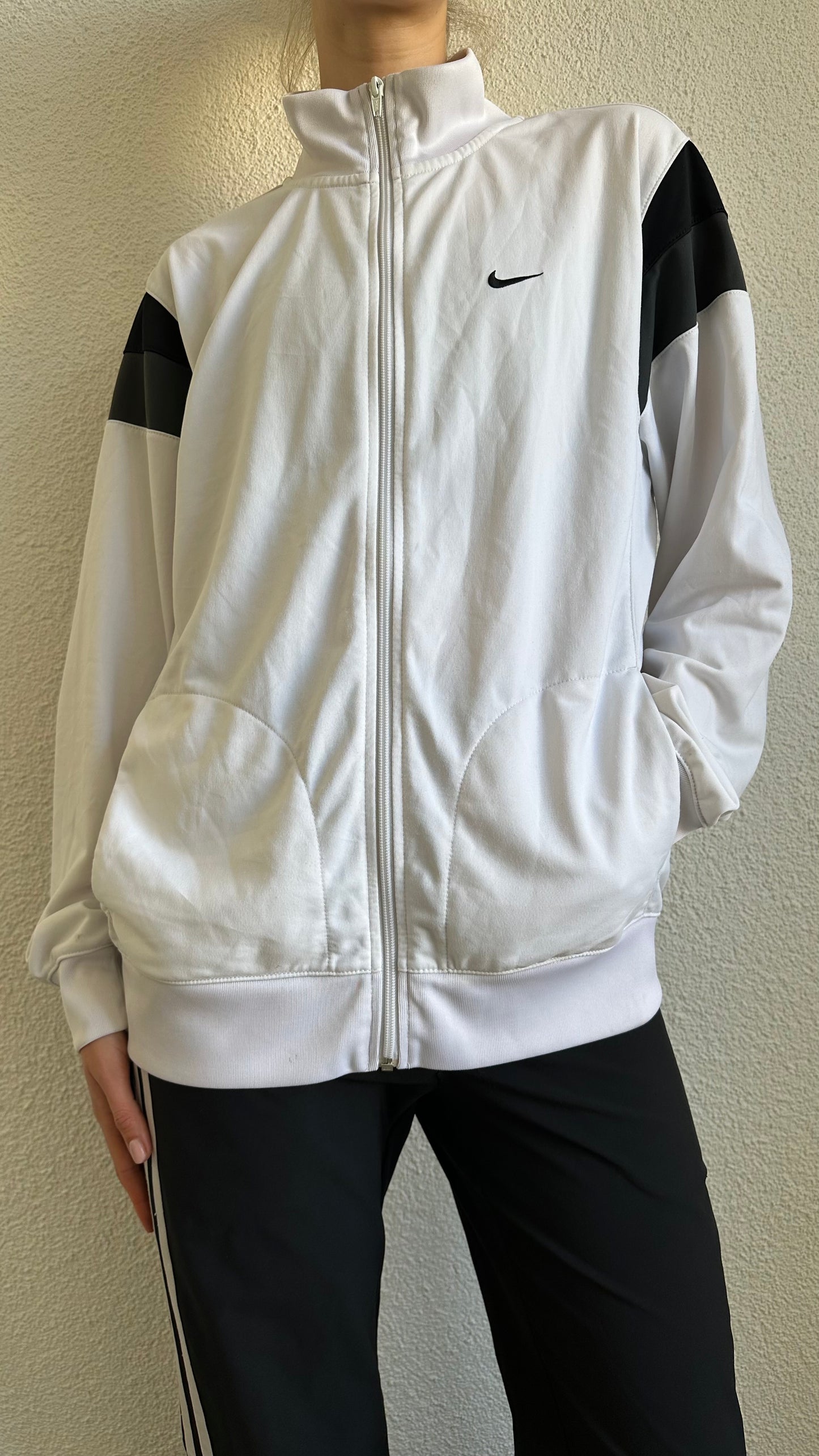 black, white and grey vest nike
