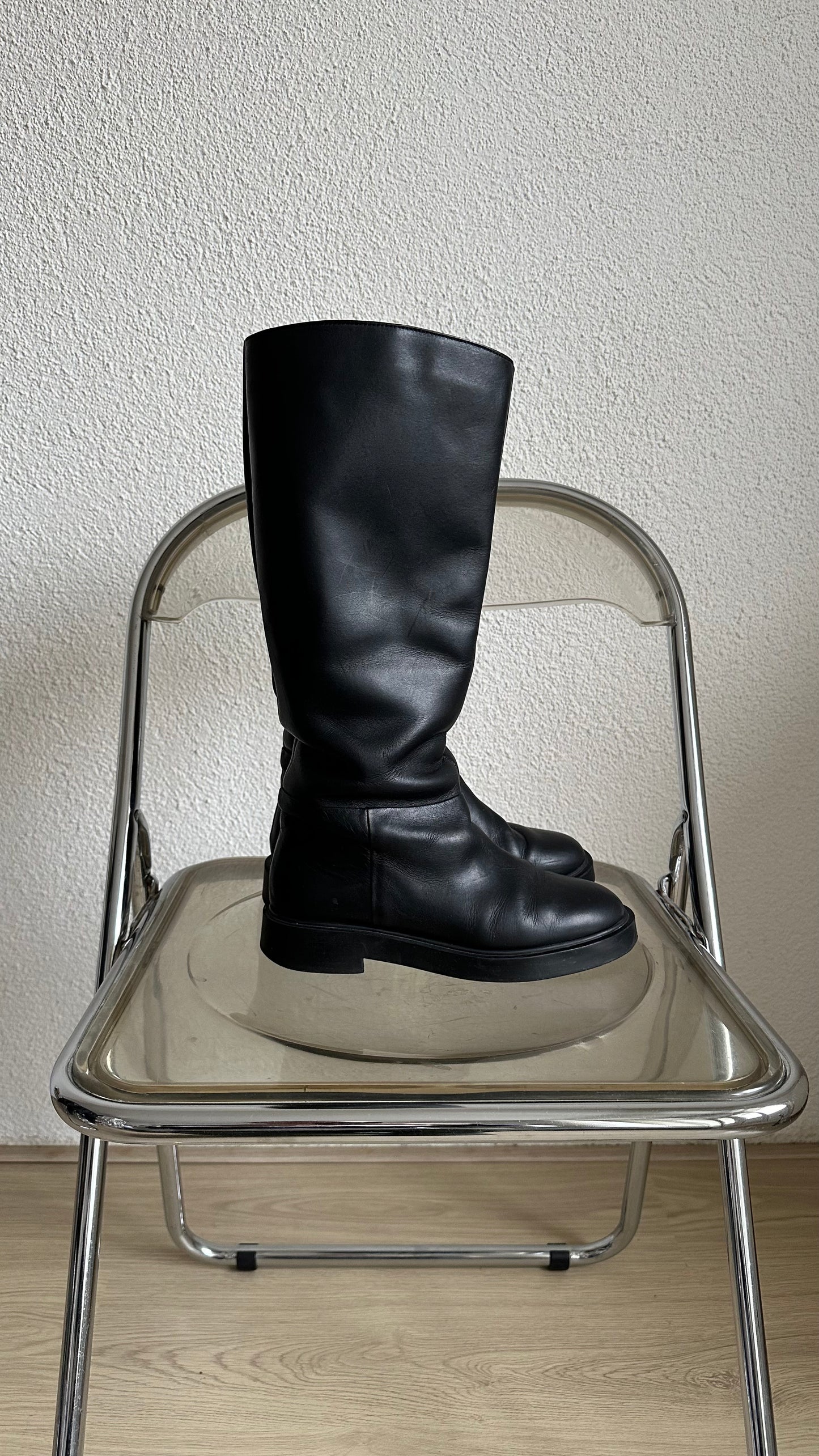 black leather high riding boots