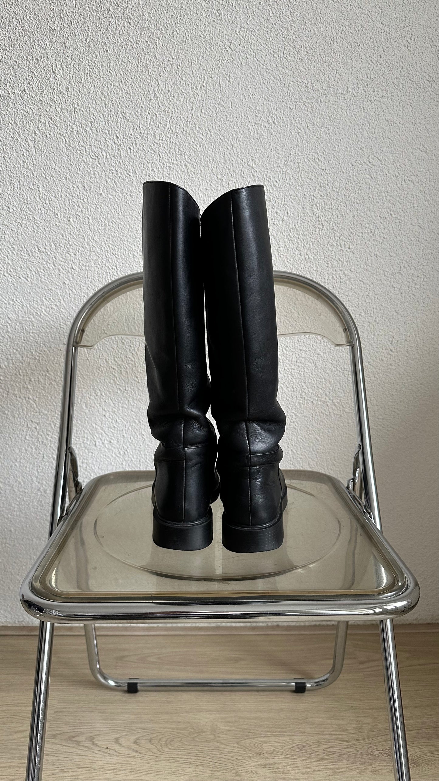 black leather high riding boots