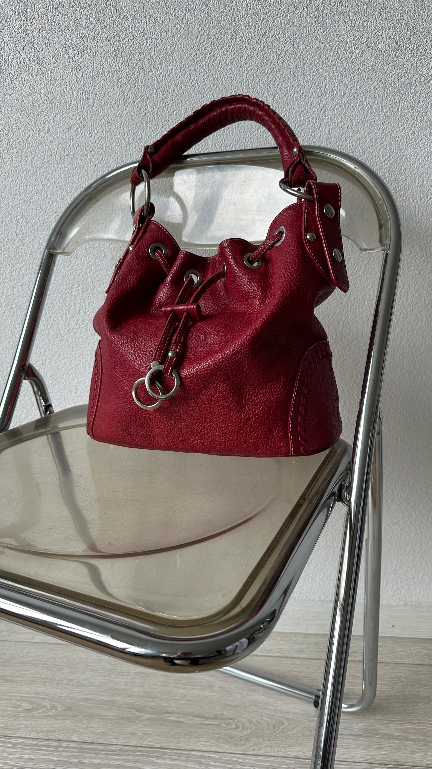 tods red leather bucket bag with silver hardware