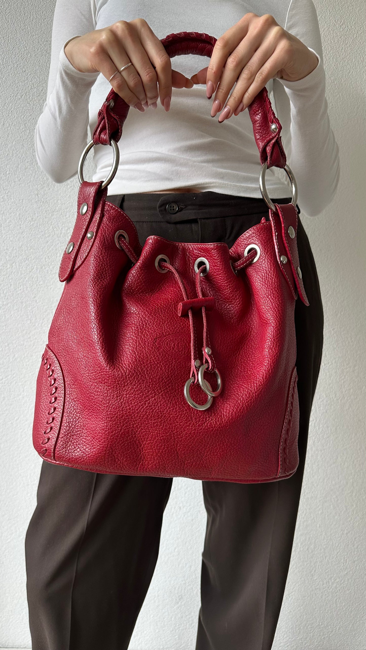 tods red leather bucket bag with silver hardware