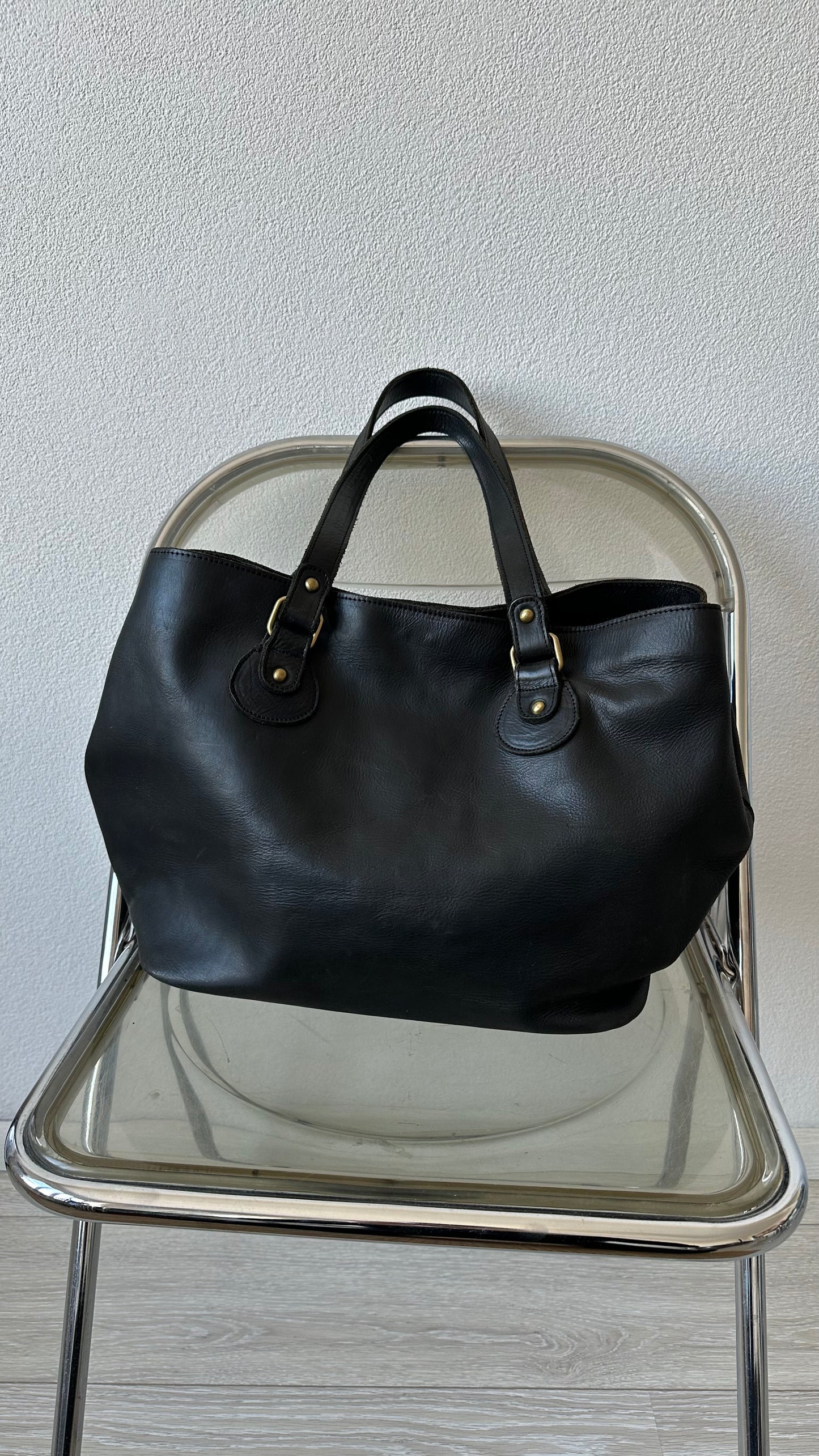 black leather shoulderbag with golden details