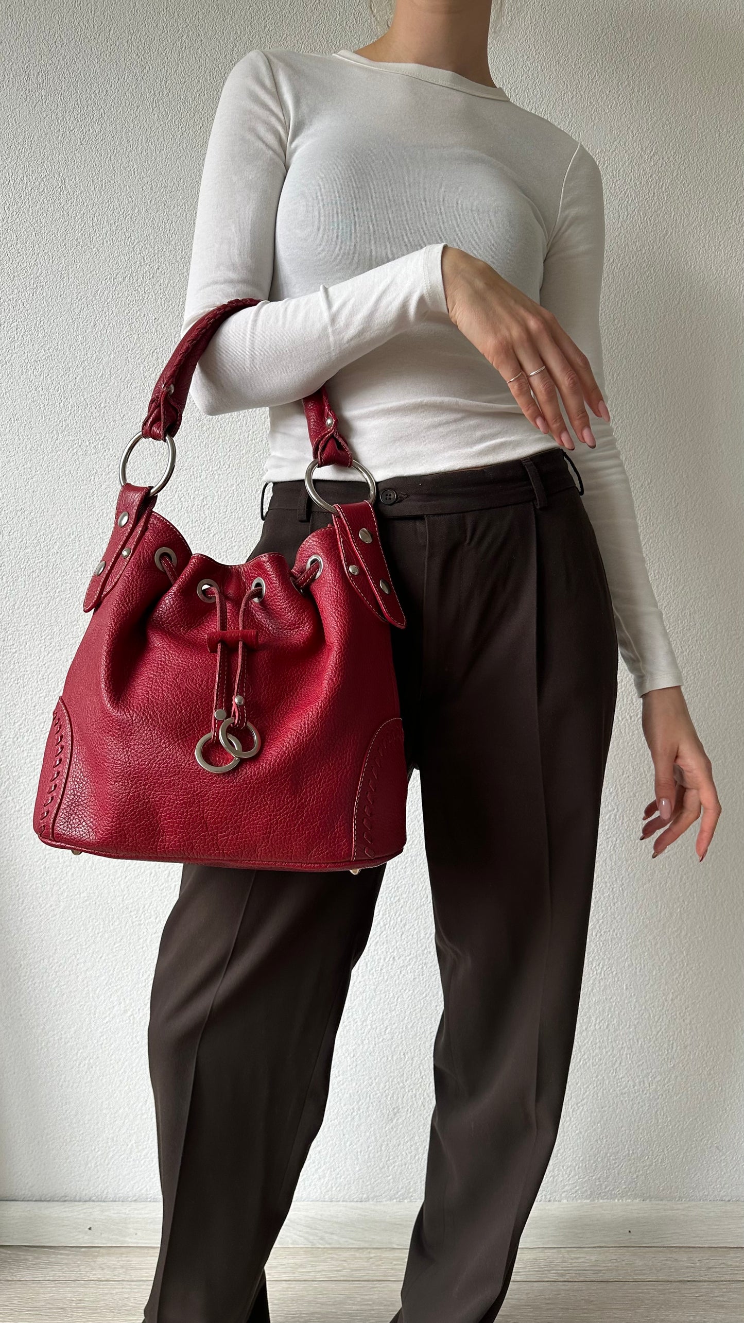 tods red leather bucket bag with silver hardware