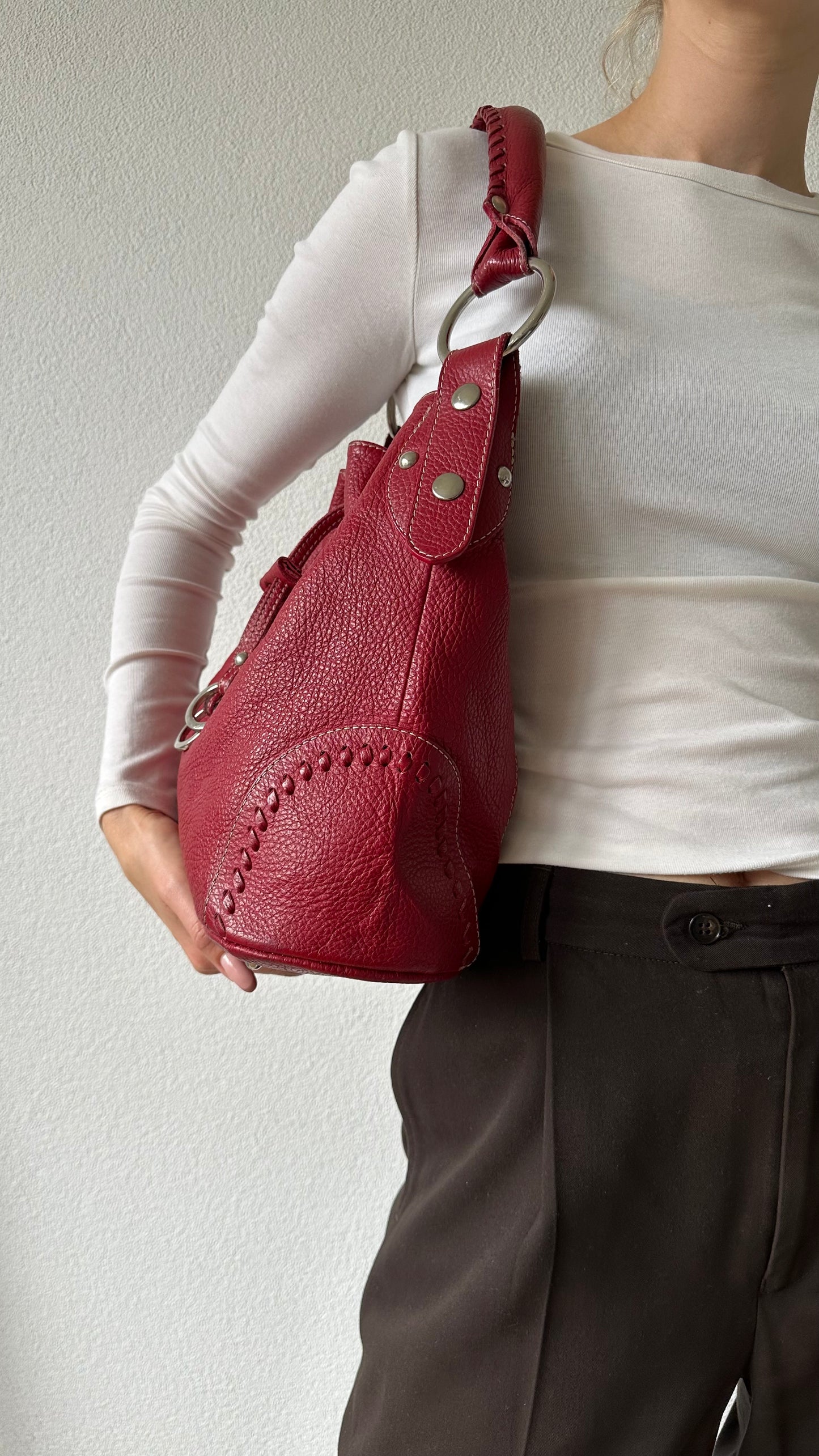 tods red leather bucket bag with silver hardware