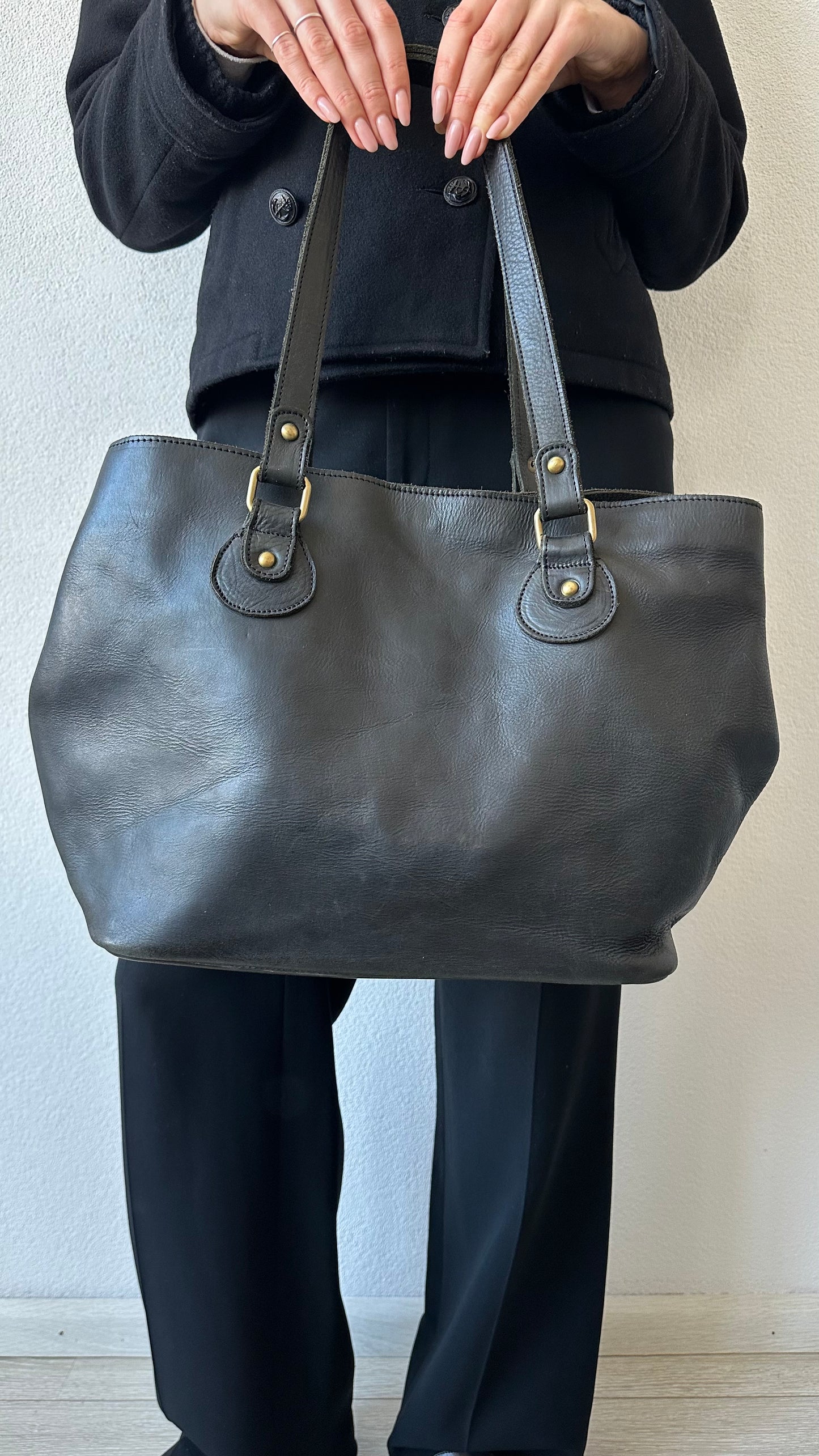 black leather shoulderbag with golden details
