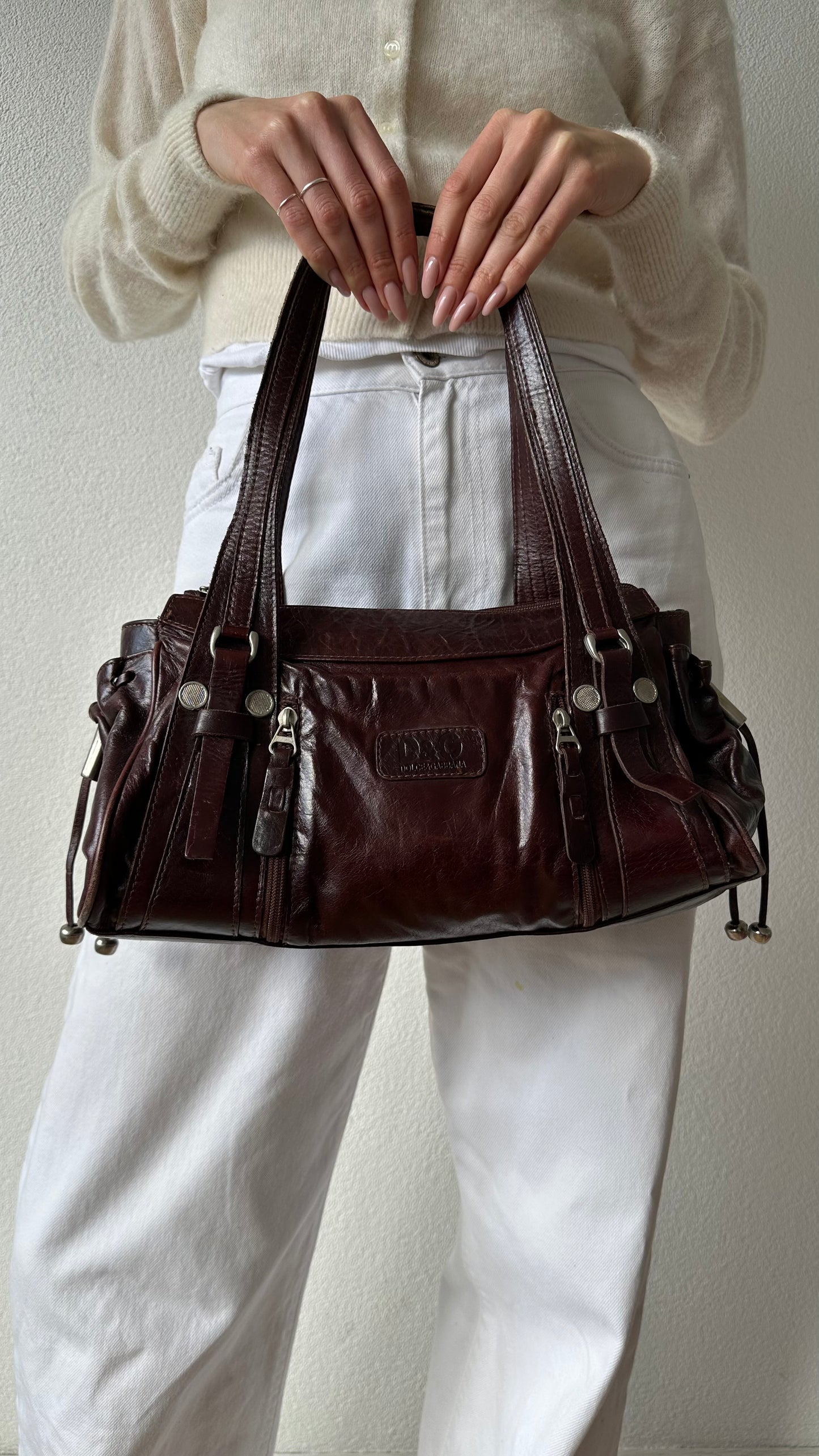 brown leather shoulder bag with silver hardware