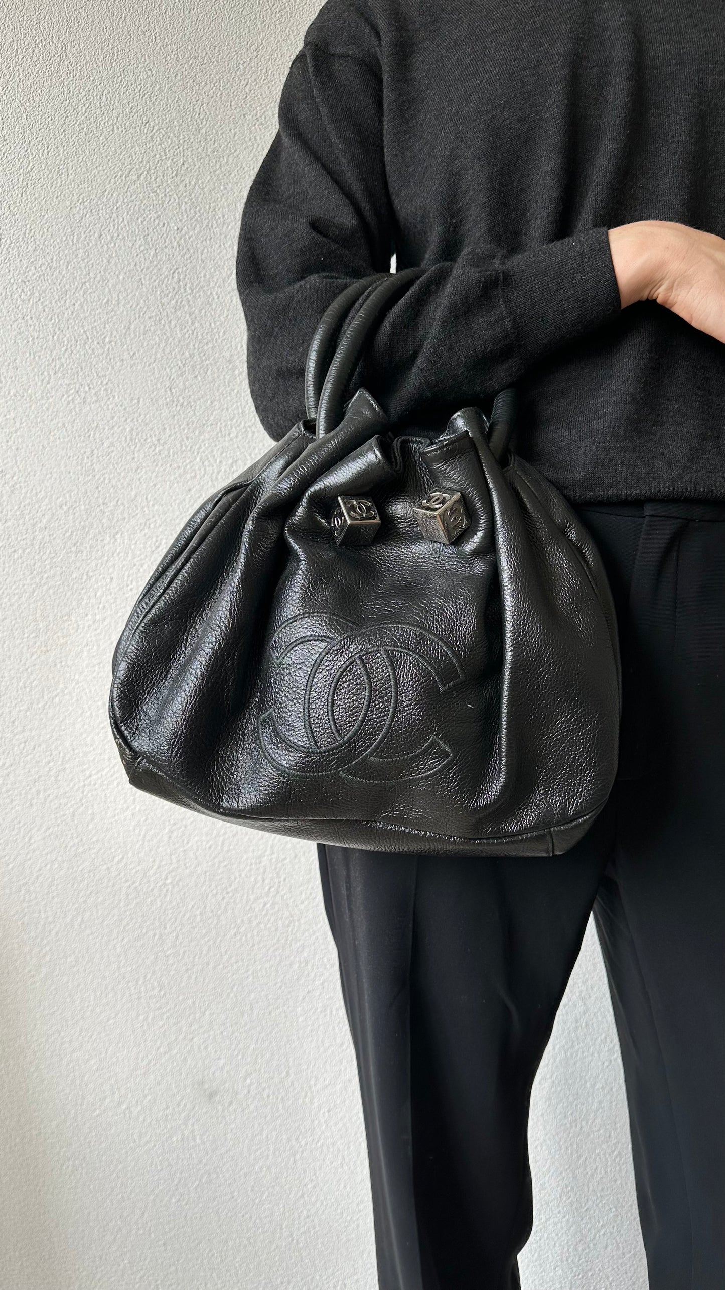 black leather bucket bag with red lining