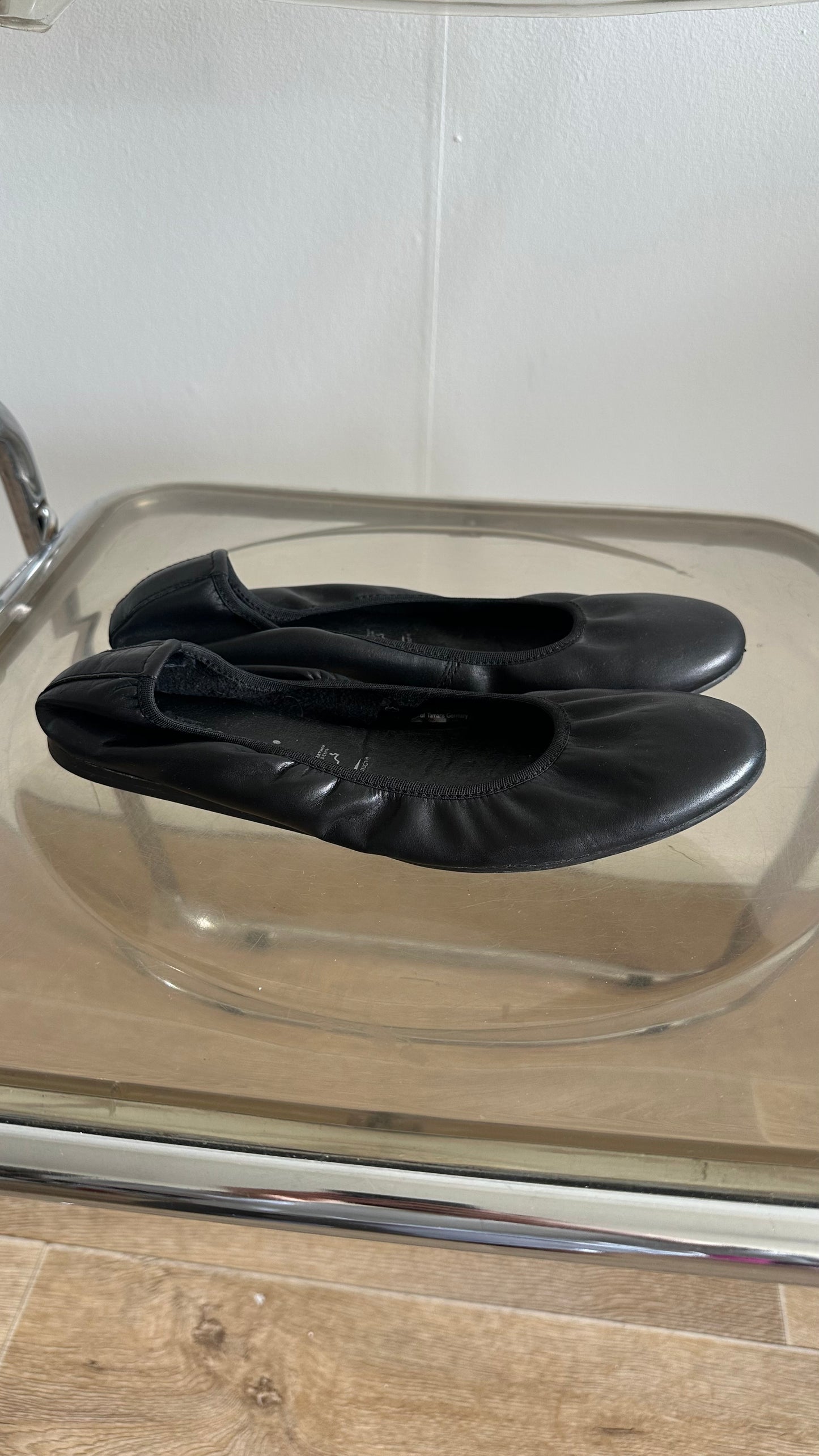 black leather ballet flats