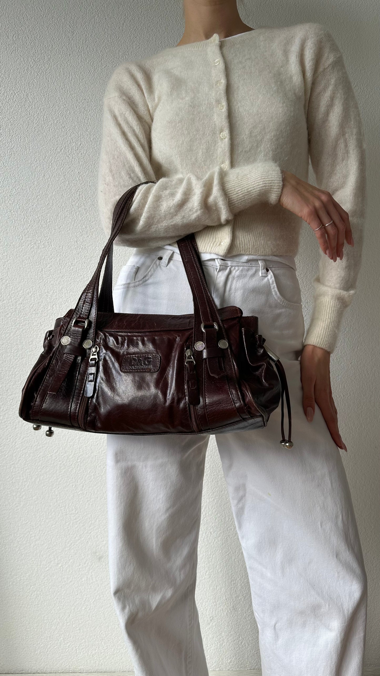 brown leather shoulder bag with silver hardware