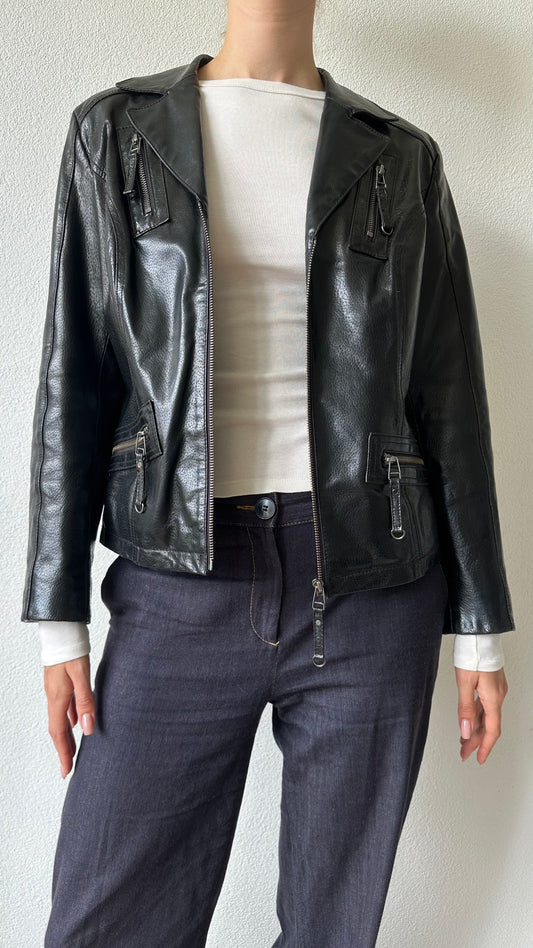 black shiny leather coat with zippered pockets