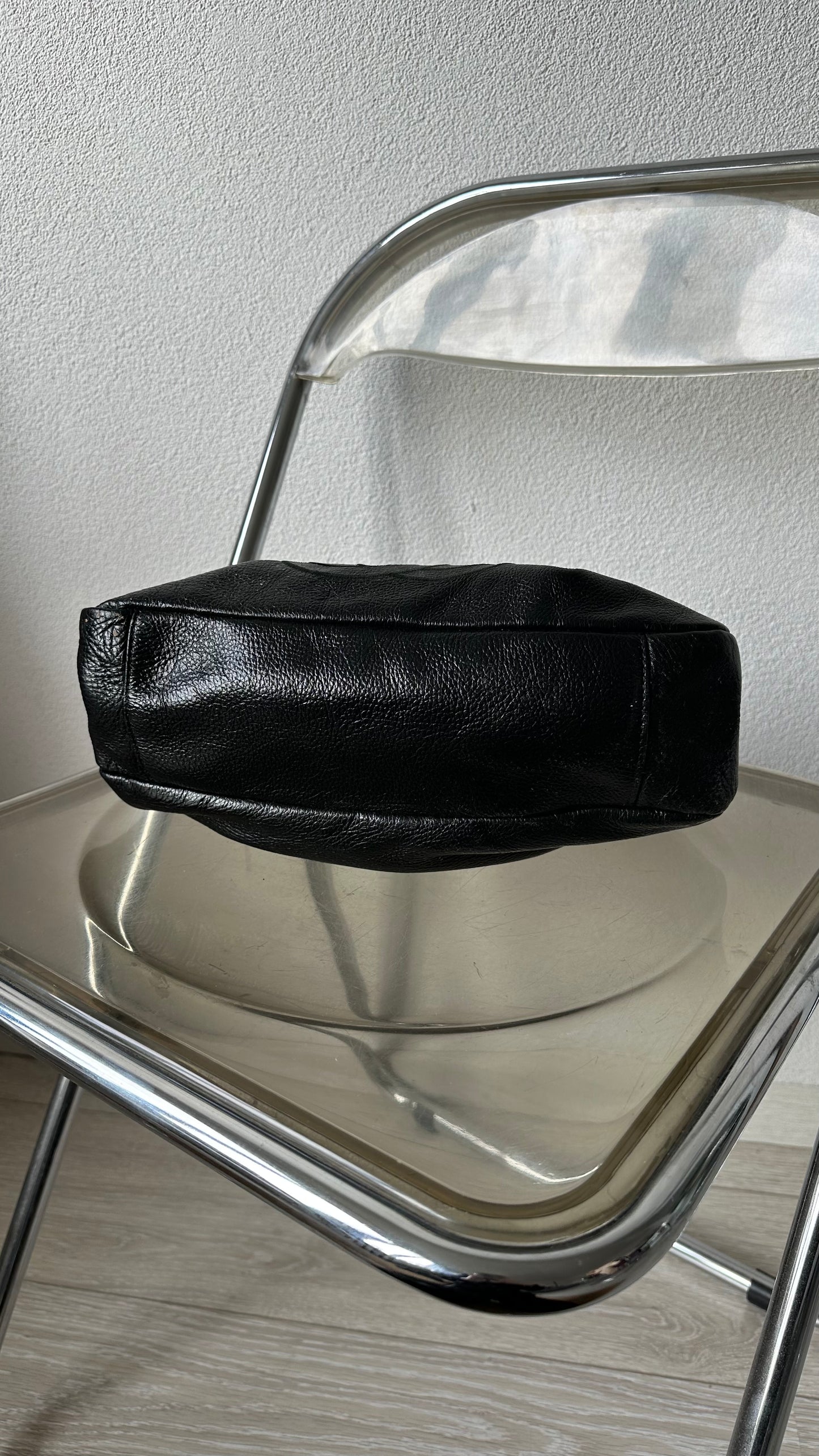 black leather bucket bag with red lining