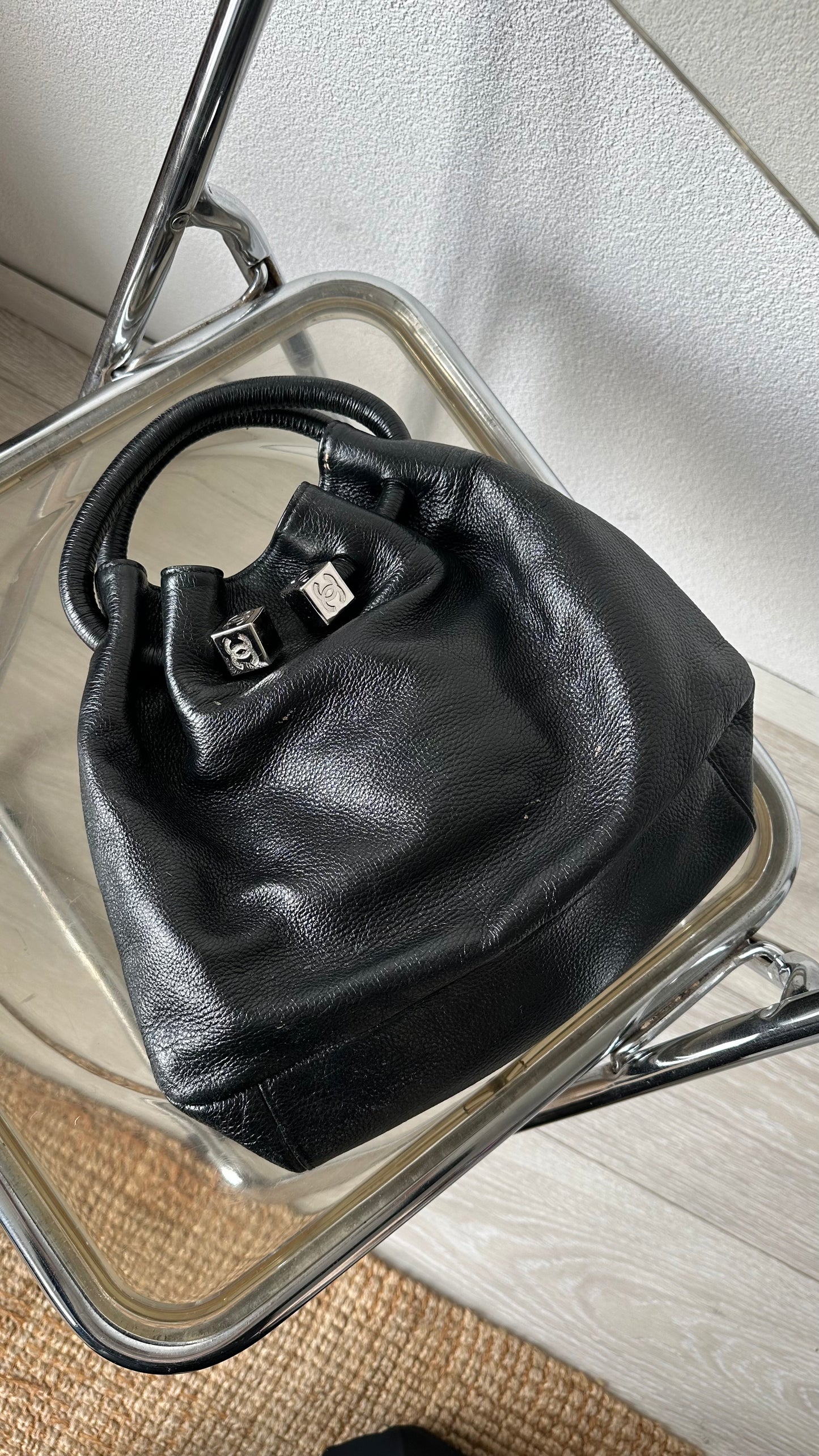 black leather bucket bag with red lining