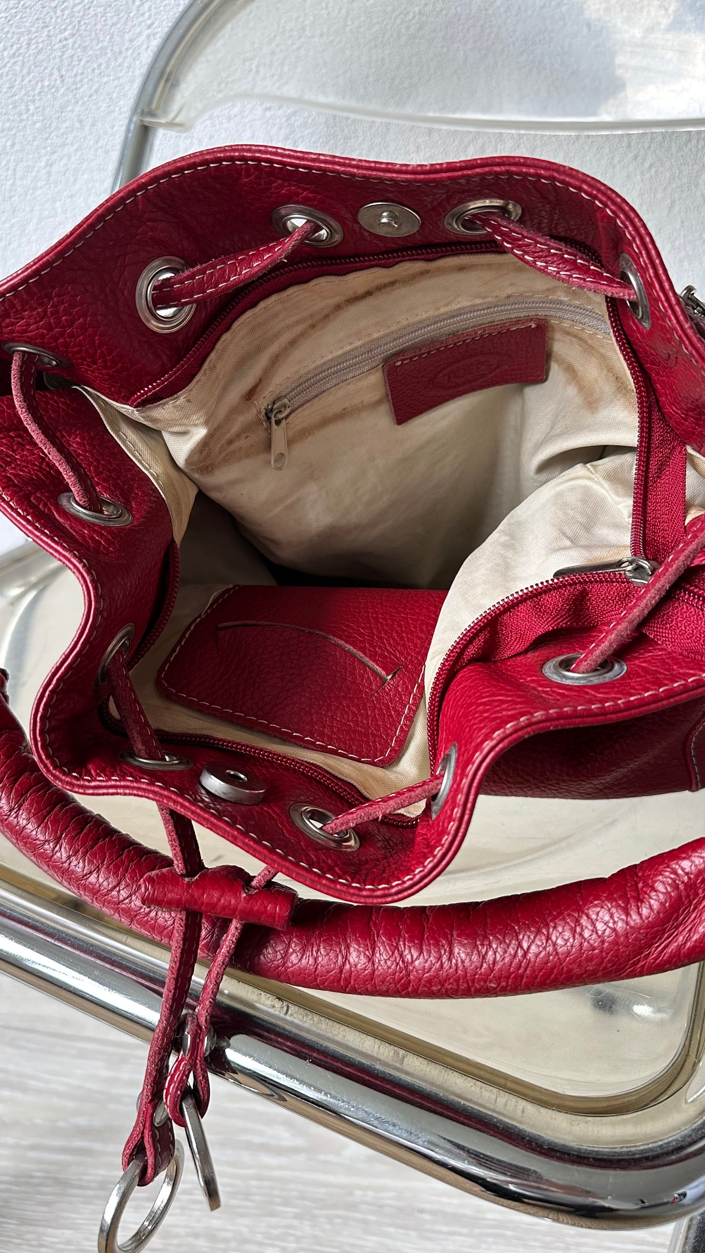 tods red leather bucket bag with silver hardware