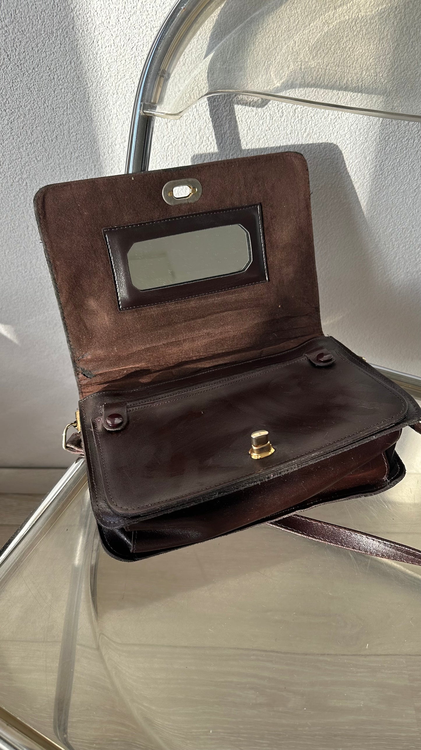 vintage brown leather messenger bag with organiser details and gold twist lock