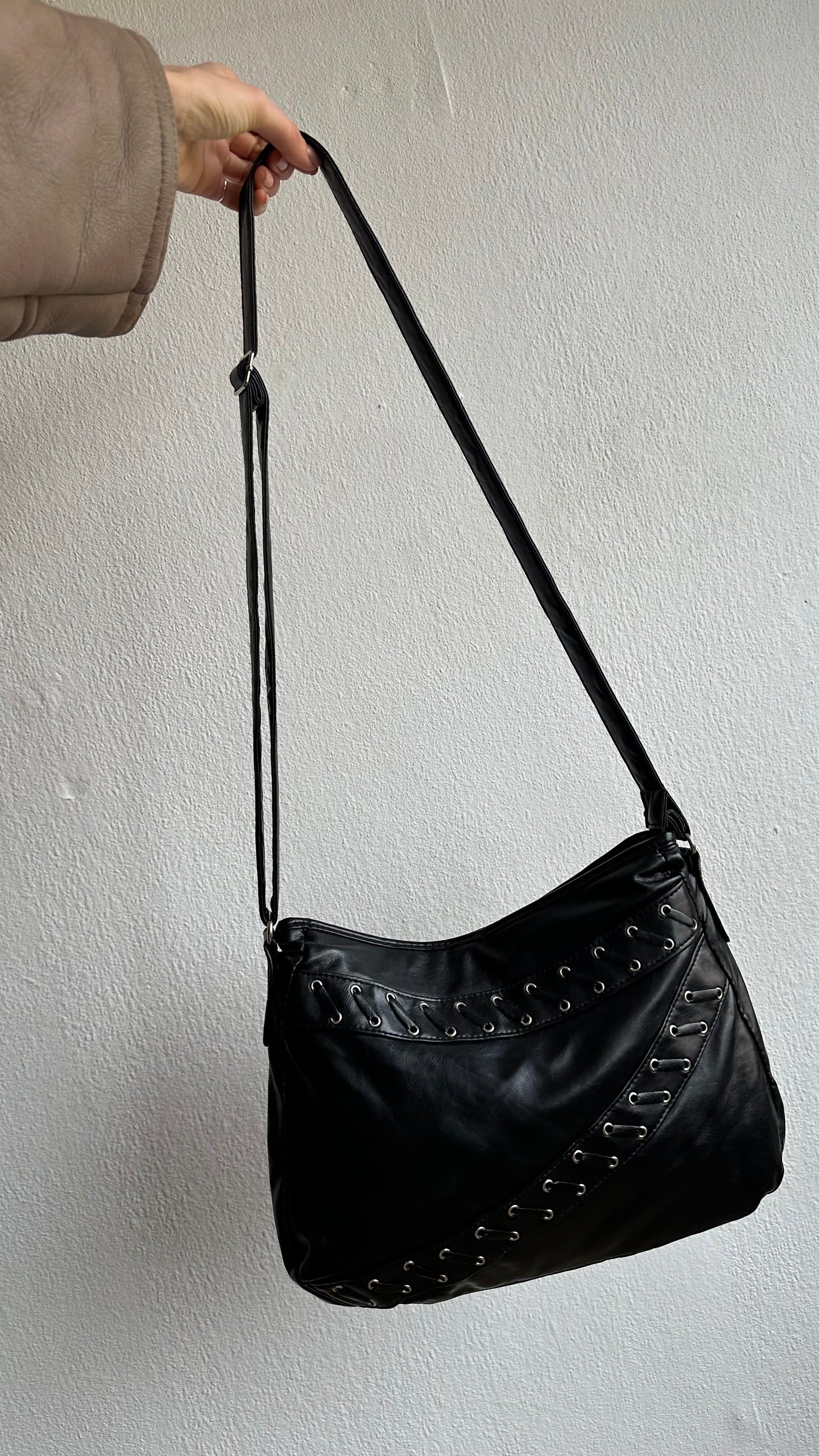 crossbody pierced faux leather bag