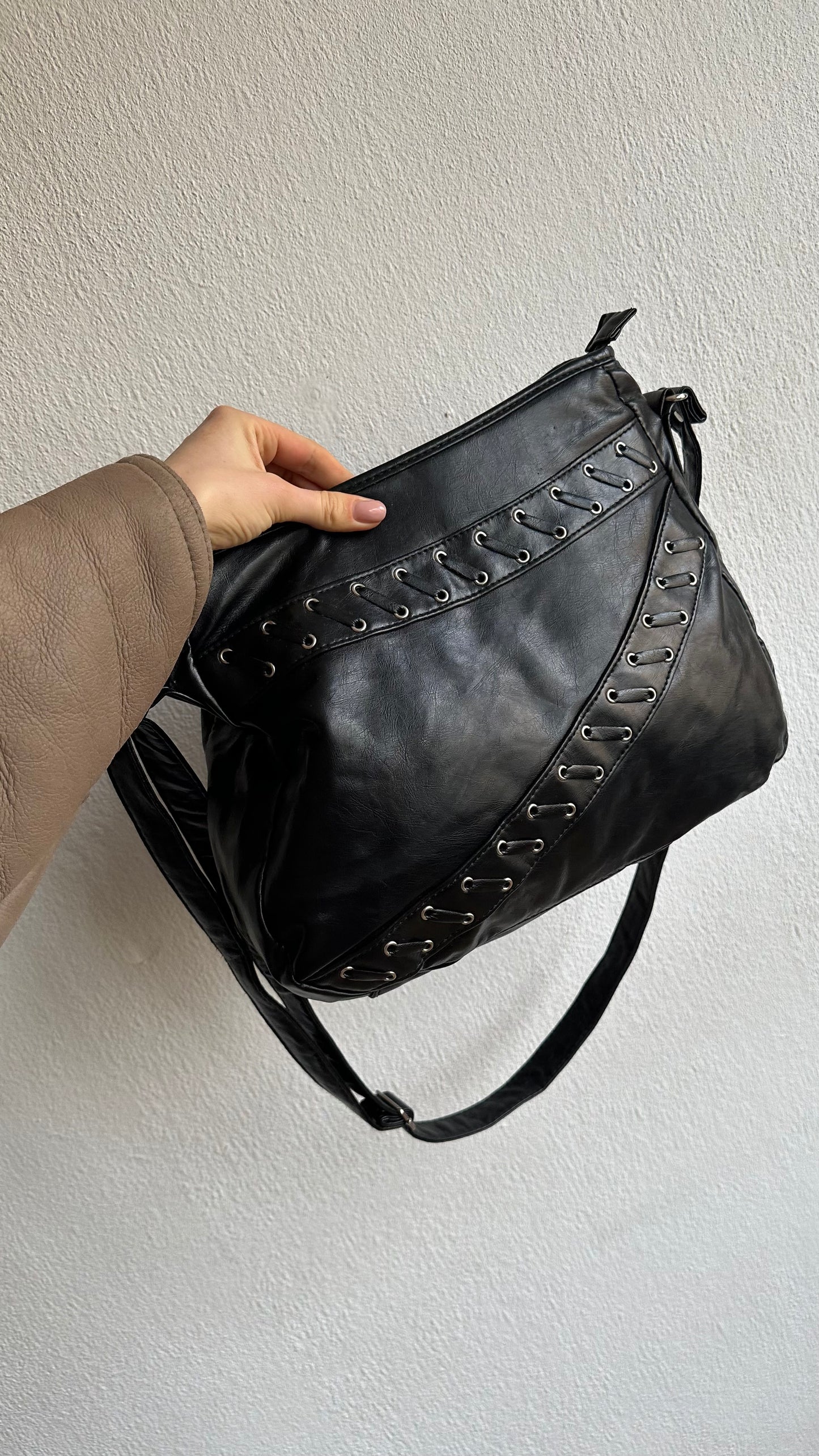 crossbody pierced faux leather bag