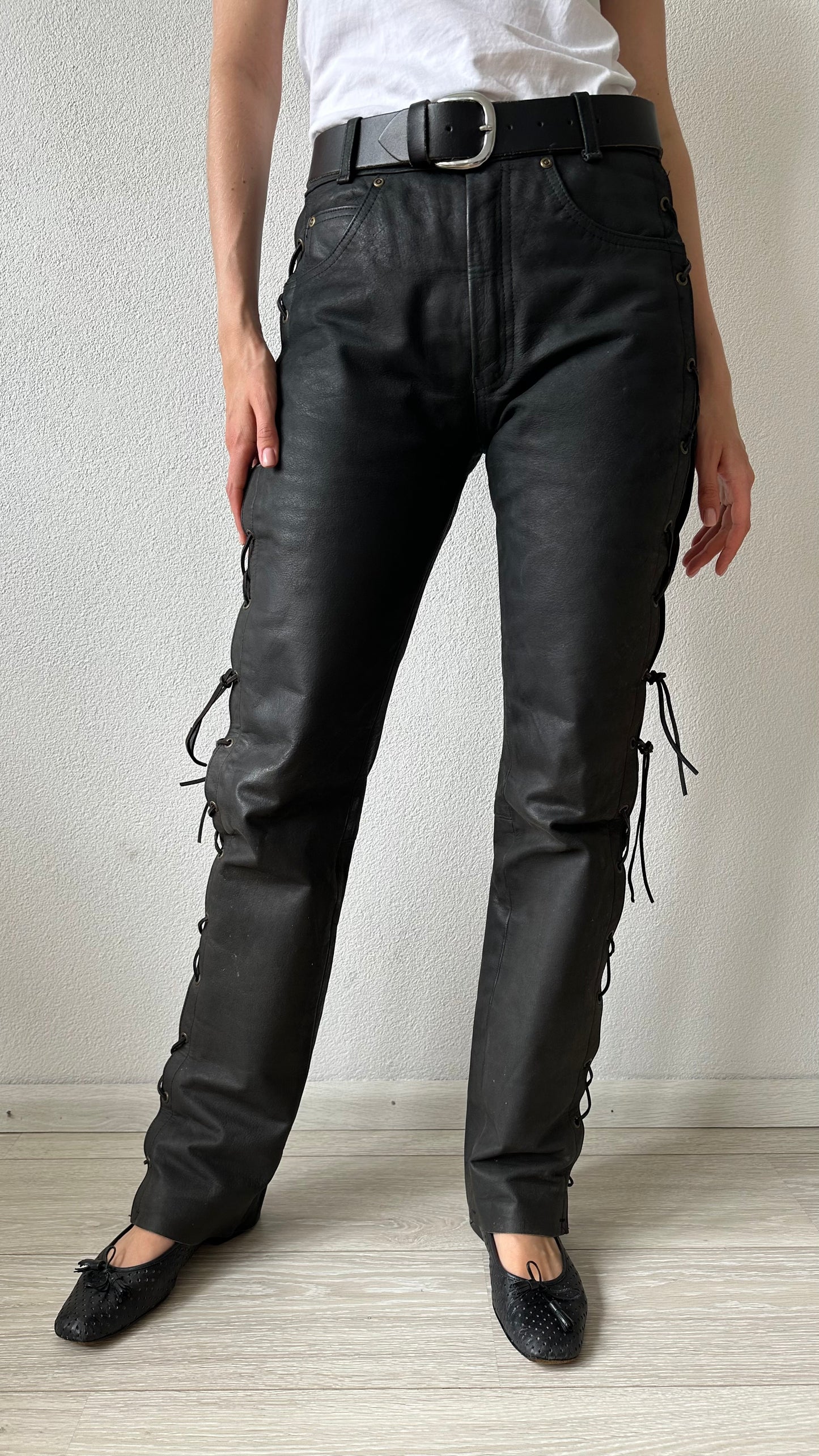 black leather trousers with braided sides and belt