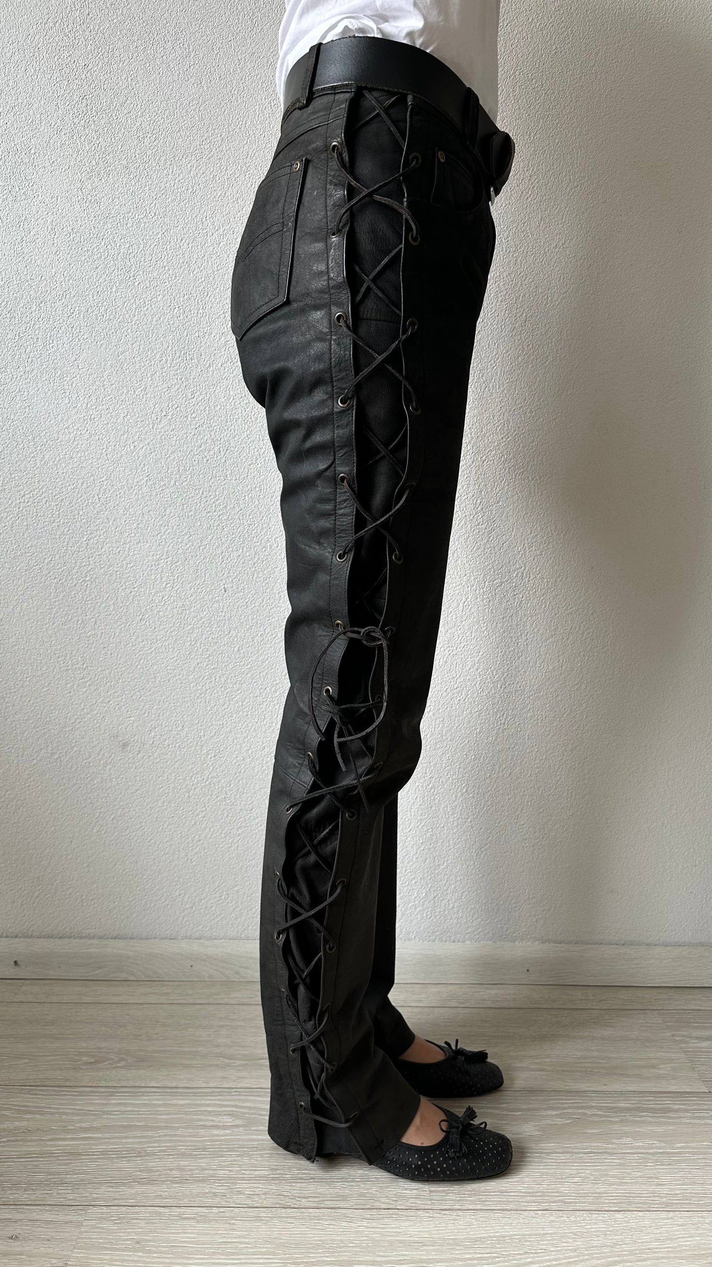 black leather trousers with braided sides and belt