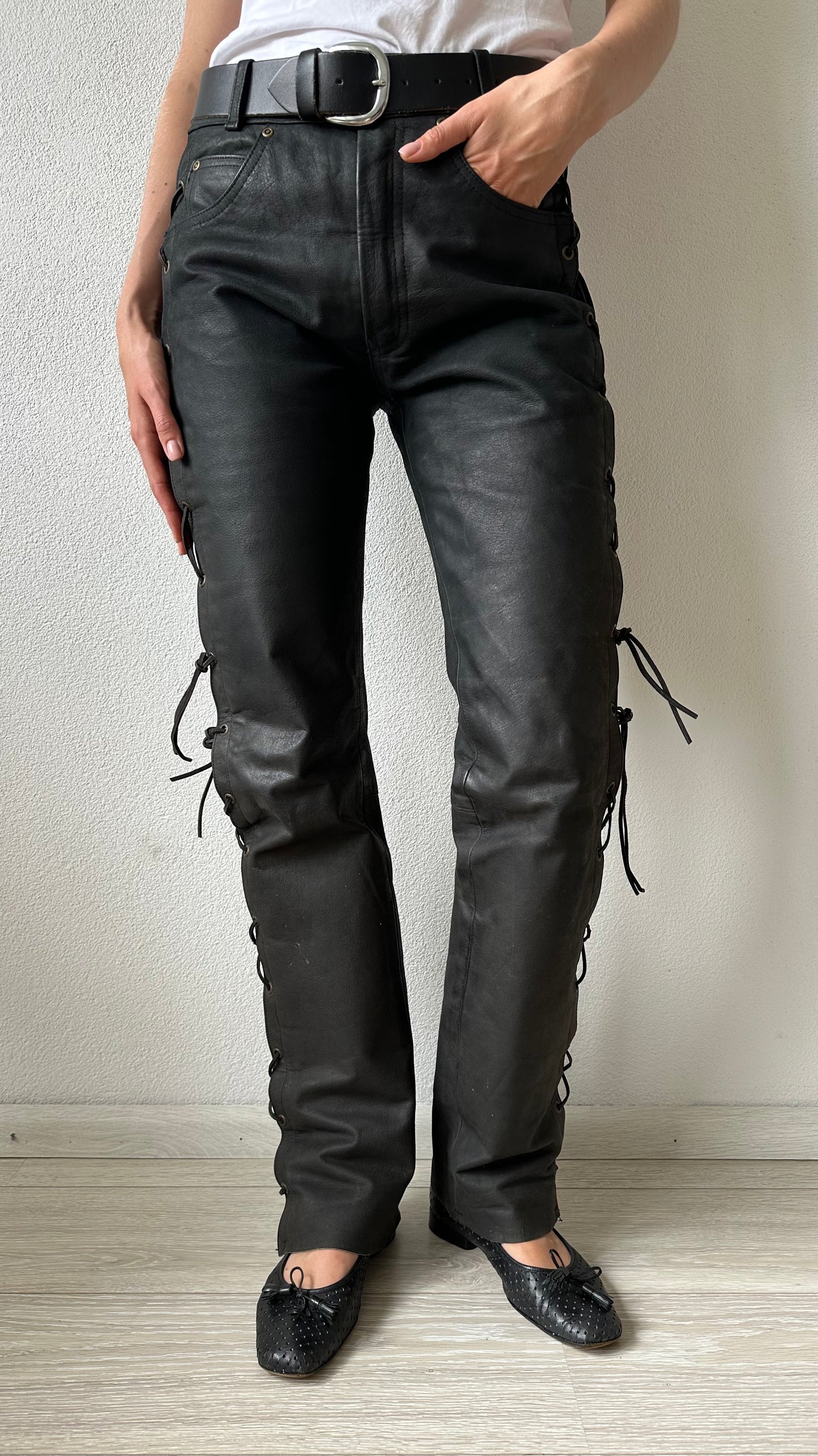 black leather trousers with braided sides and belt